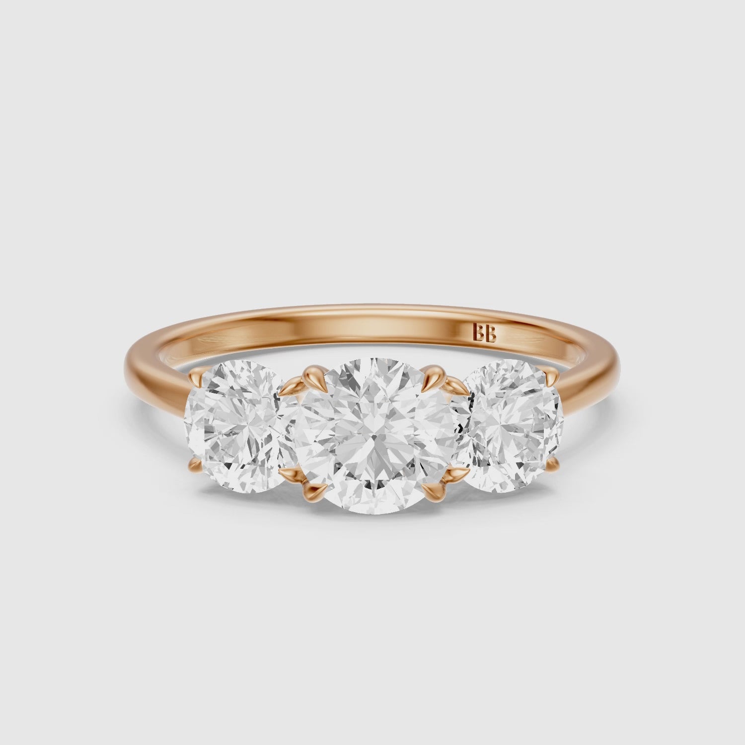 Load video: Kassie Round Cut Three Stone Cathedral Style Lab Grown Diamond Ring