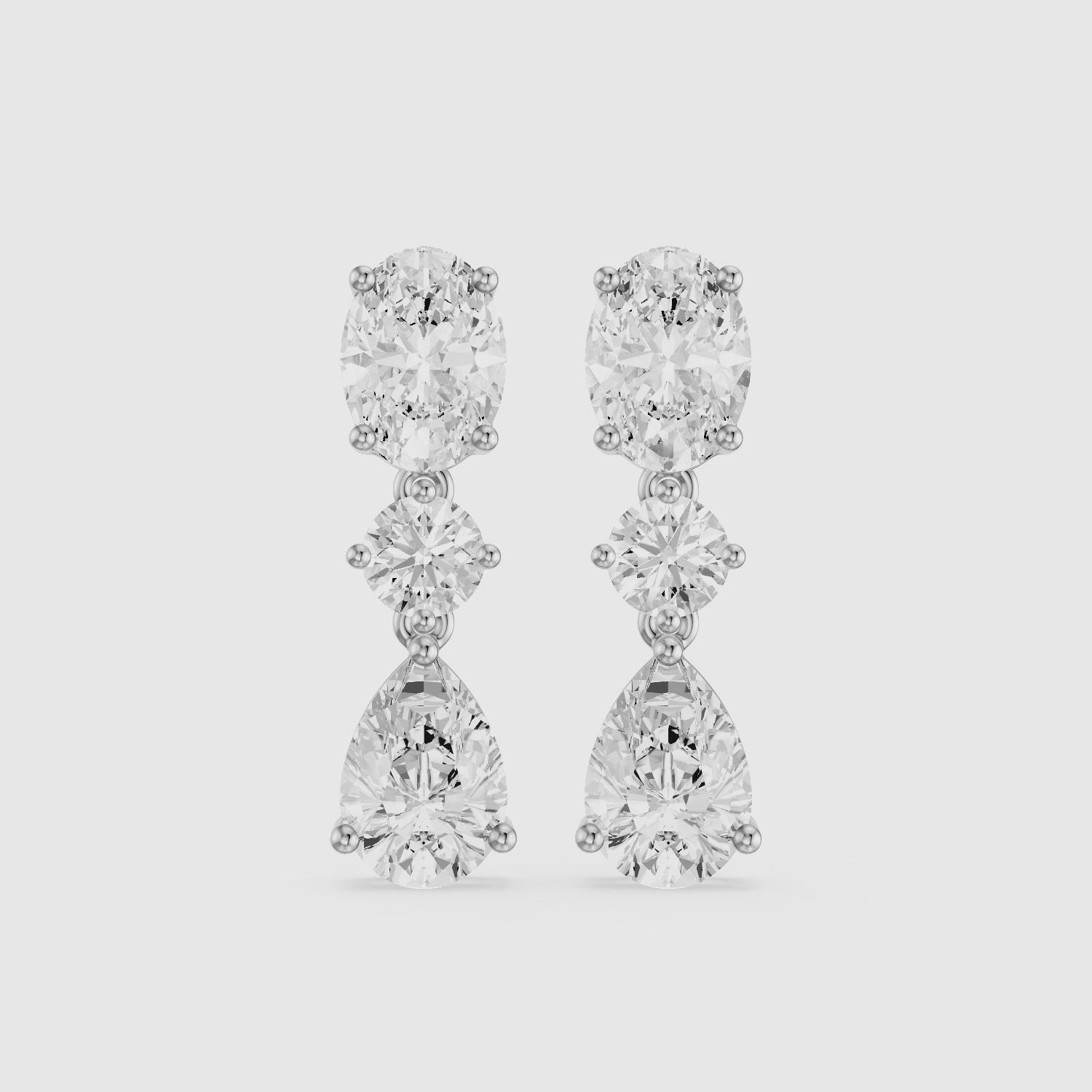 Load video: Iliana Oval, Round and Pear Cut Lab Grown Diamond Dangle Earrings