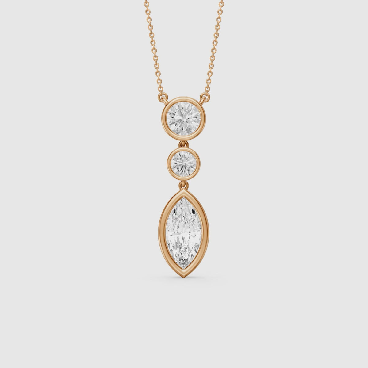 Load video: Astrid Marquise and Round Lab Grown Diamond Bezel Drop Pendant