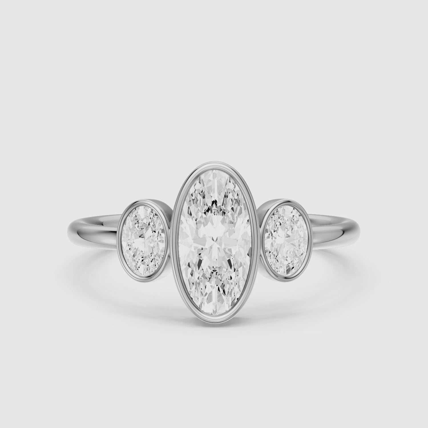 Load video: Darcy Moval Cut Moissanite Diamond Bezel Ring with Oval Side Stones