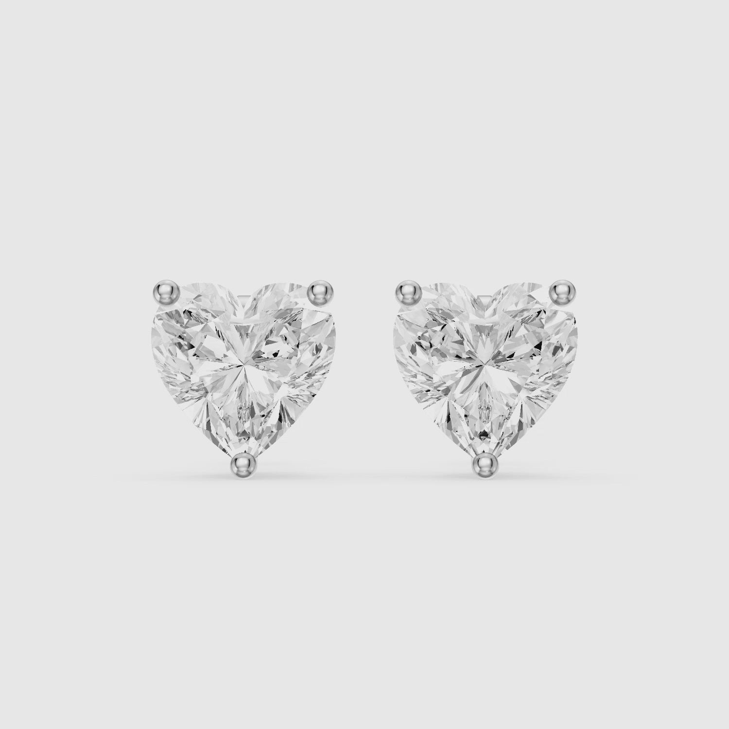 Load video: Cristina Heart Shape Lab Grown Diamond Solitaire Stud Earrings