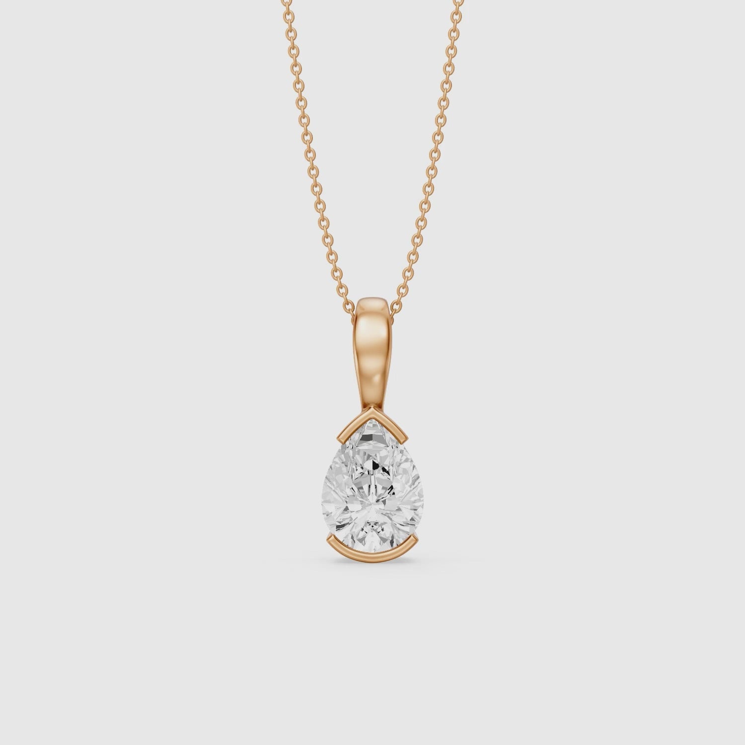 Load video: Adriana Pear Shape Lab Grown Diamond Half Bezel Pendant
