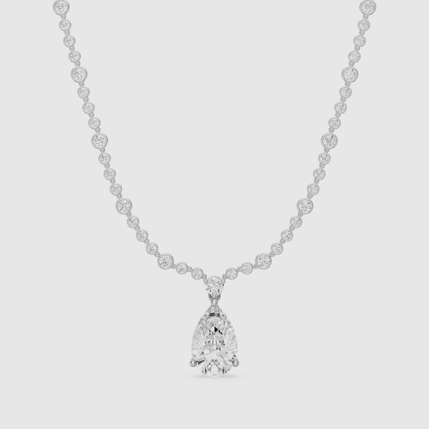 Load video: Estella Graduated Round Bezel Lab Grown Diamond Pear Drop Necklace