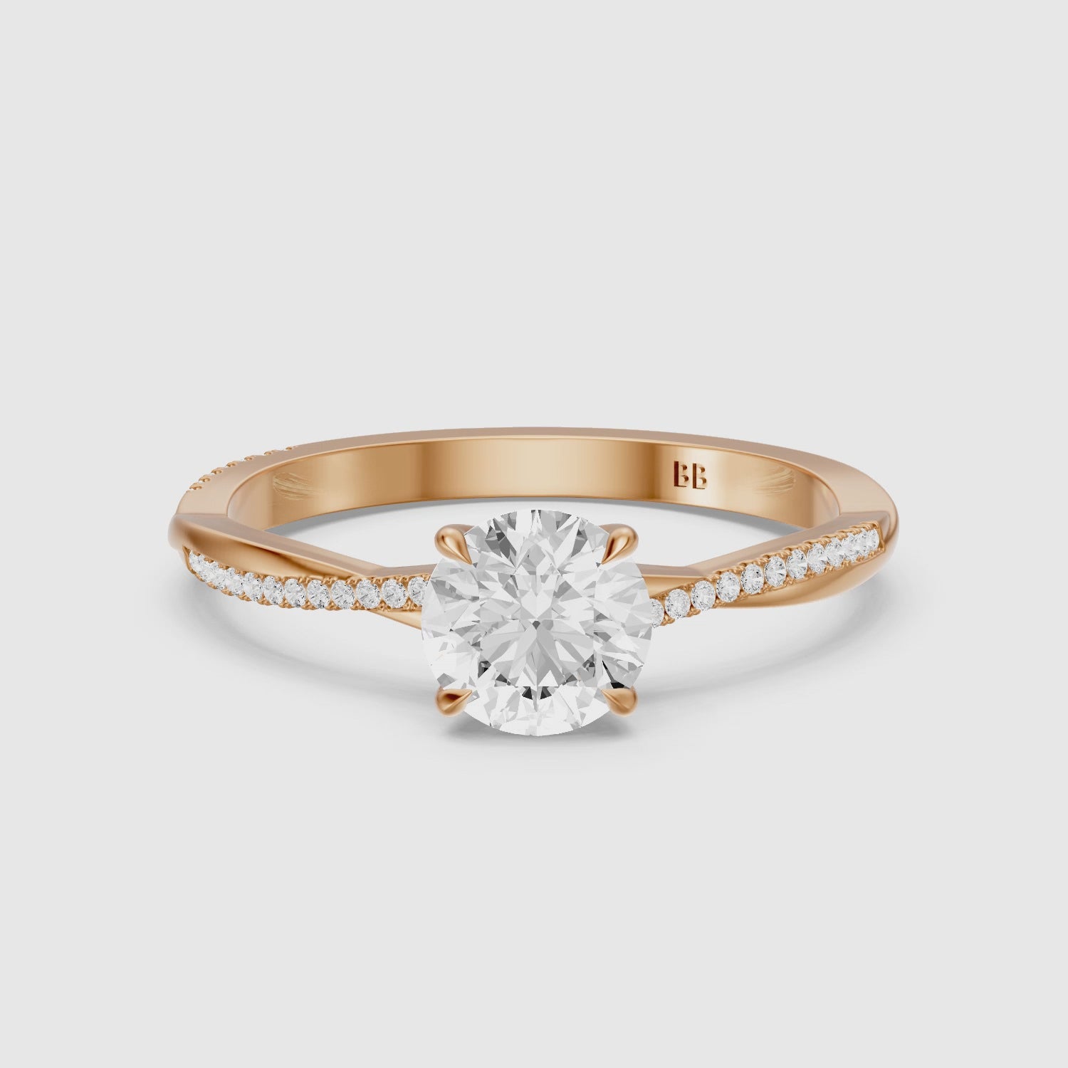 Load video: Carrie Round Cut Twisted Pave Side Stone Moissanite Diamond Ring