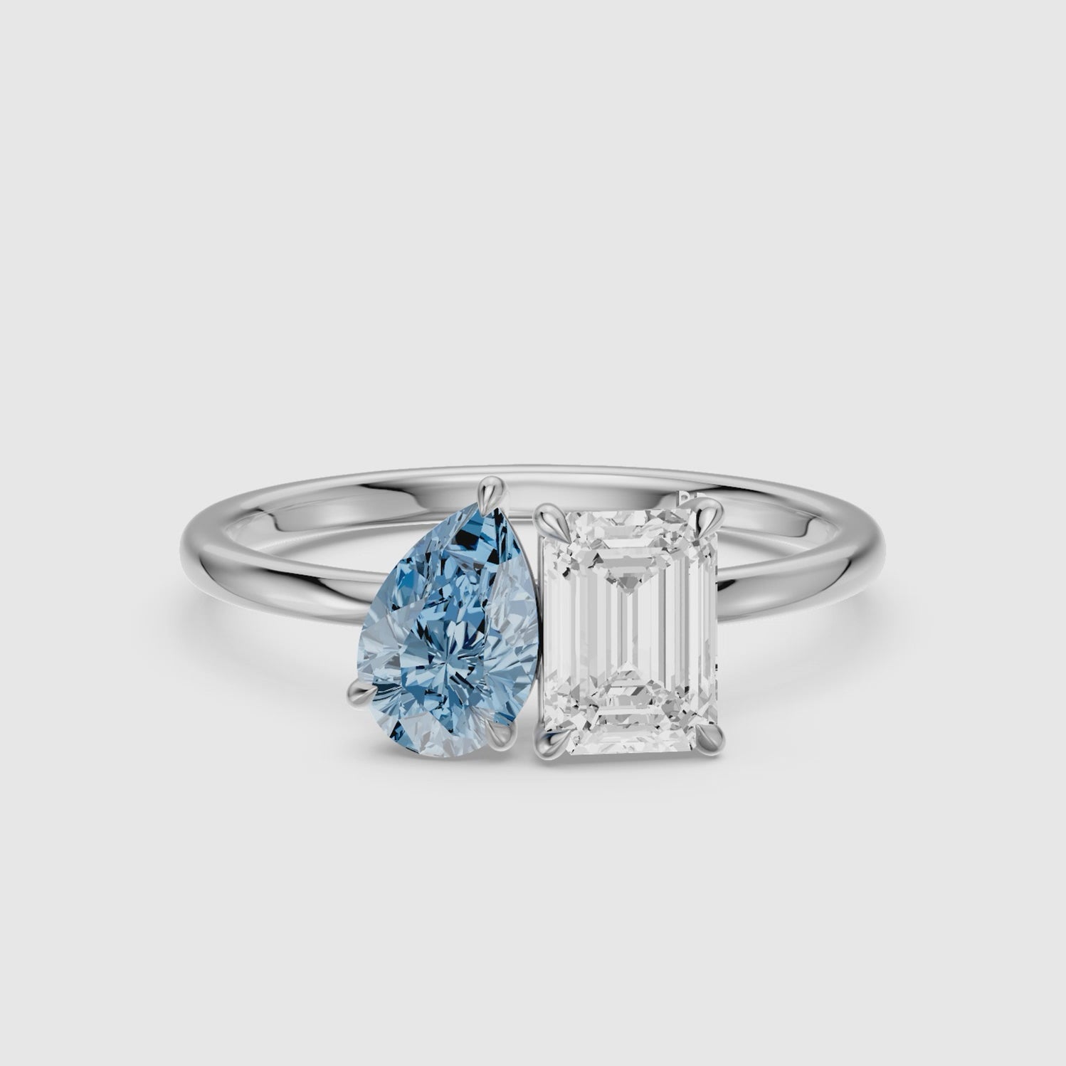 Load video: Eliska Blue Pear and Emerald Cut Color Lab Grown Diamond Toi et Moi Ring