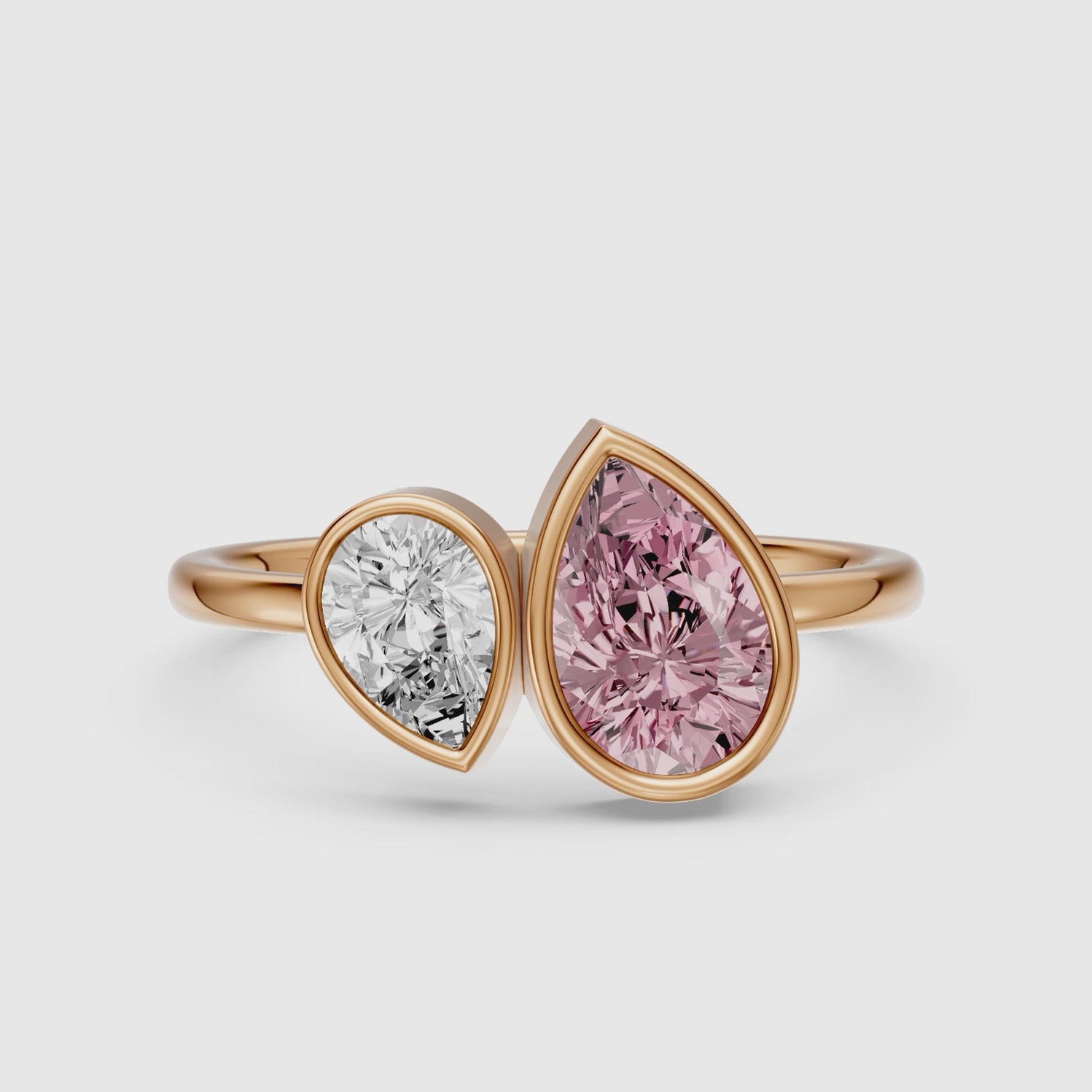 Load video: Prisca Pink and White Pear Cut Colored Lab Grown Diamond Toi et Moi Bezel Ring
