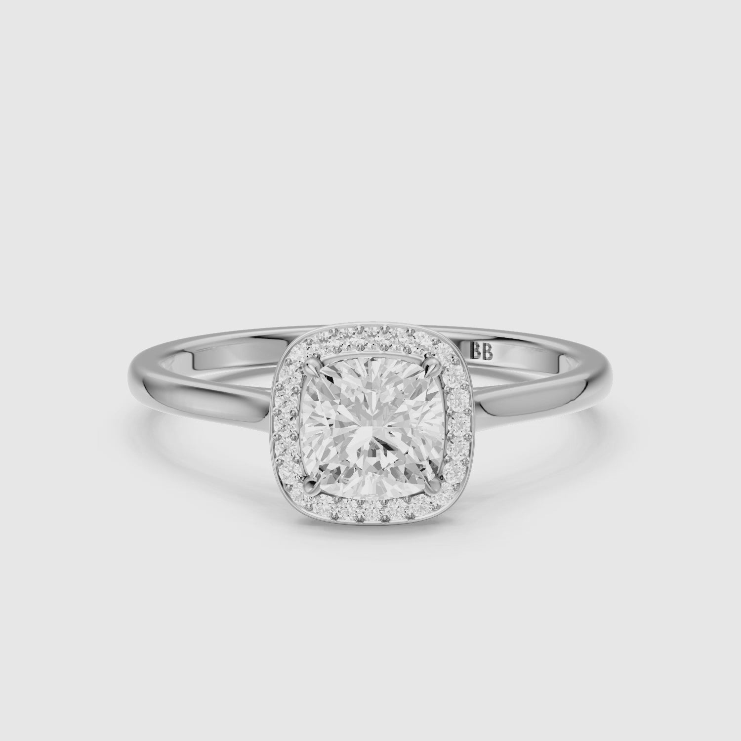 Load video: Emberly Cushion Cut Halo Cathedral Style Moissanite Diamond Ring