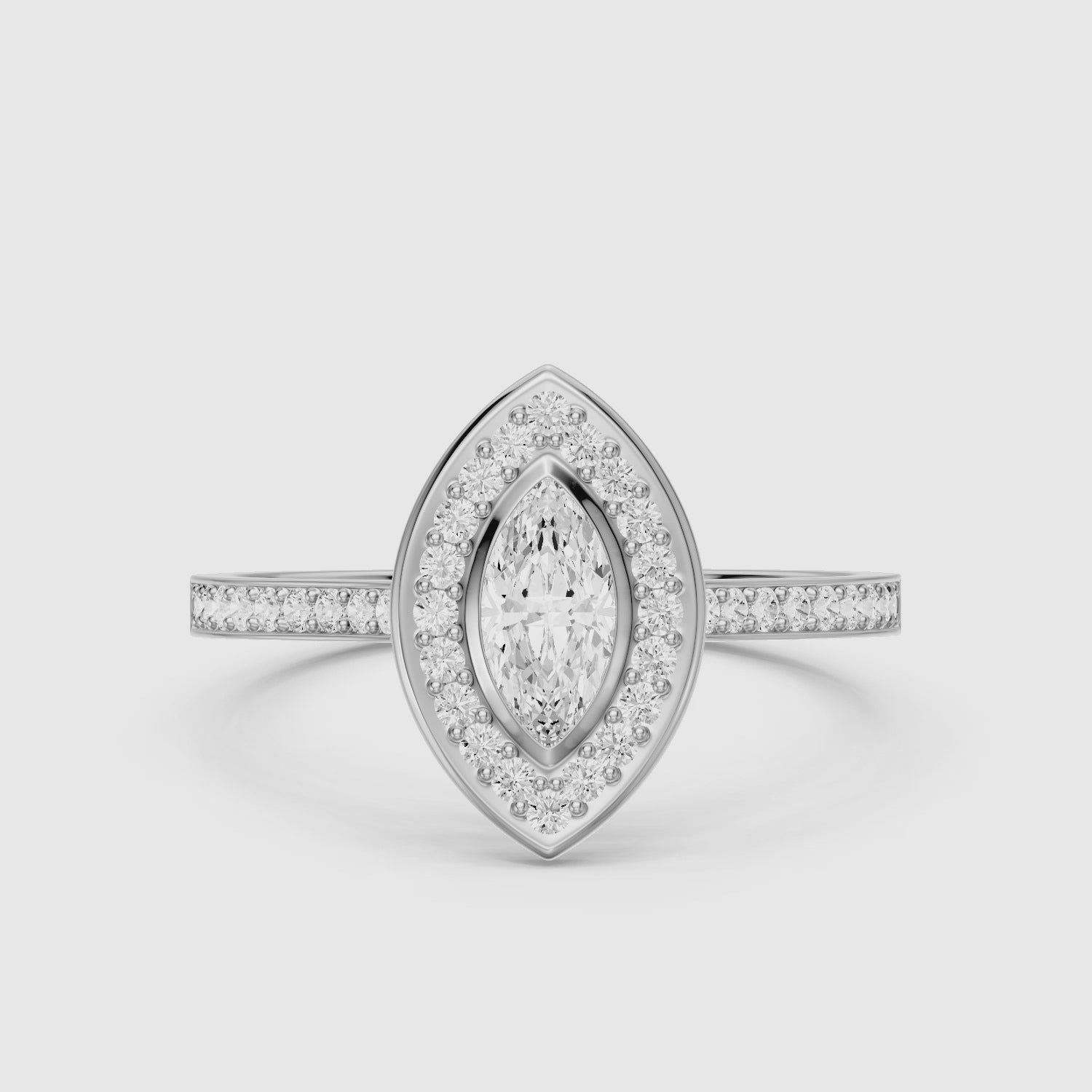 Load video: Celeste Marquise Moissanite Diamond Ring with Bezel Inspired Halo Setting