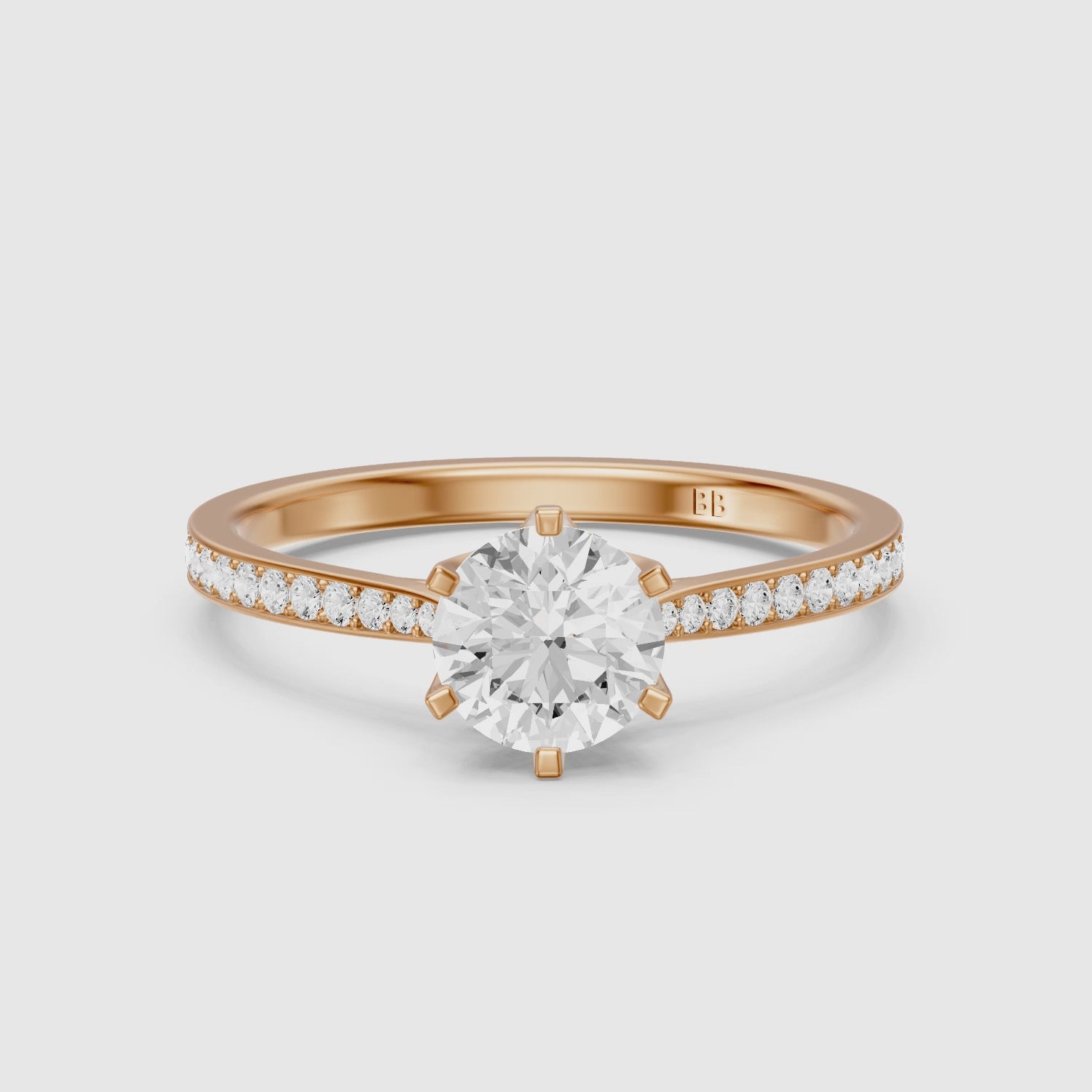 Load video: Desire 6 Prong Round Cut Side Stone Channel Set Moissanite Diamond Ring