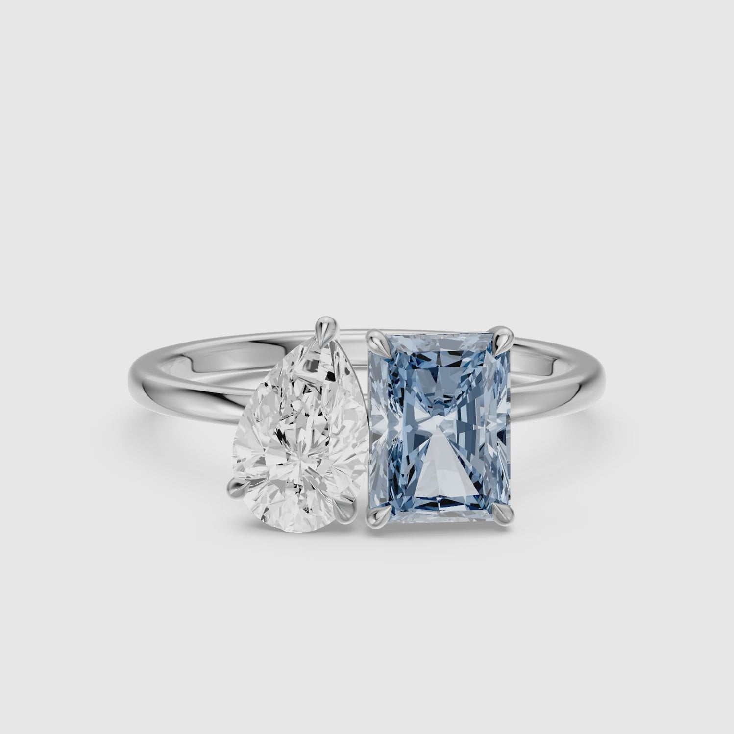 Load video: Milica Blue Radiant and Pear Cut Colored Lab Grown Diamond Toi et Moi Ring