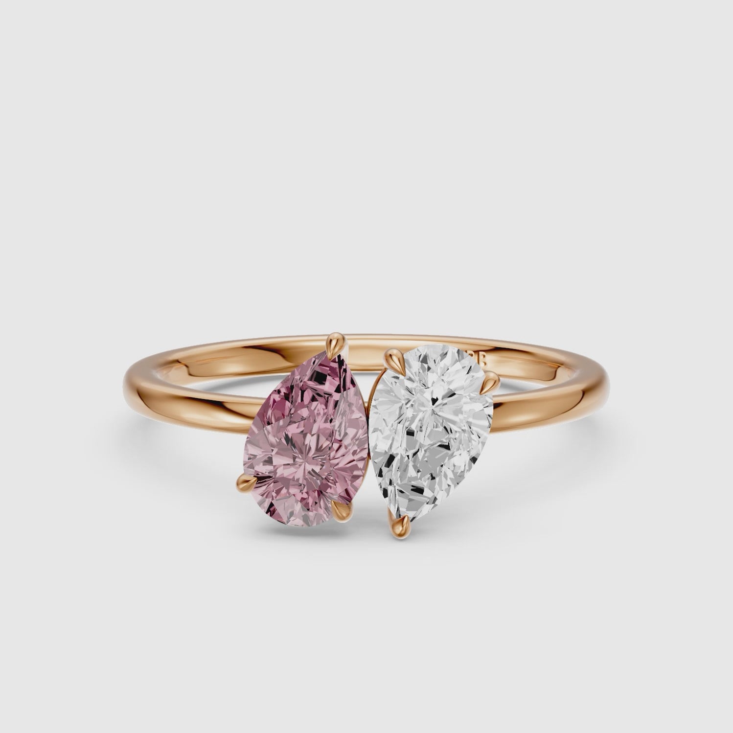 Load video: Audra Pink and White Both Pear Cut Color Lab Grown Diamond Toi et Moi Ring