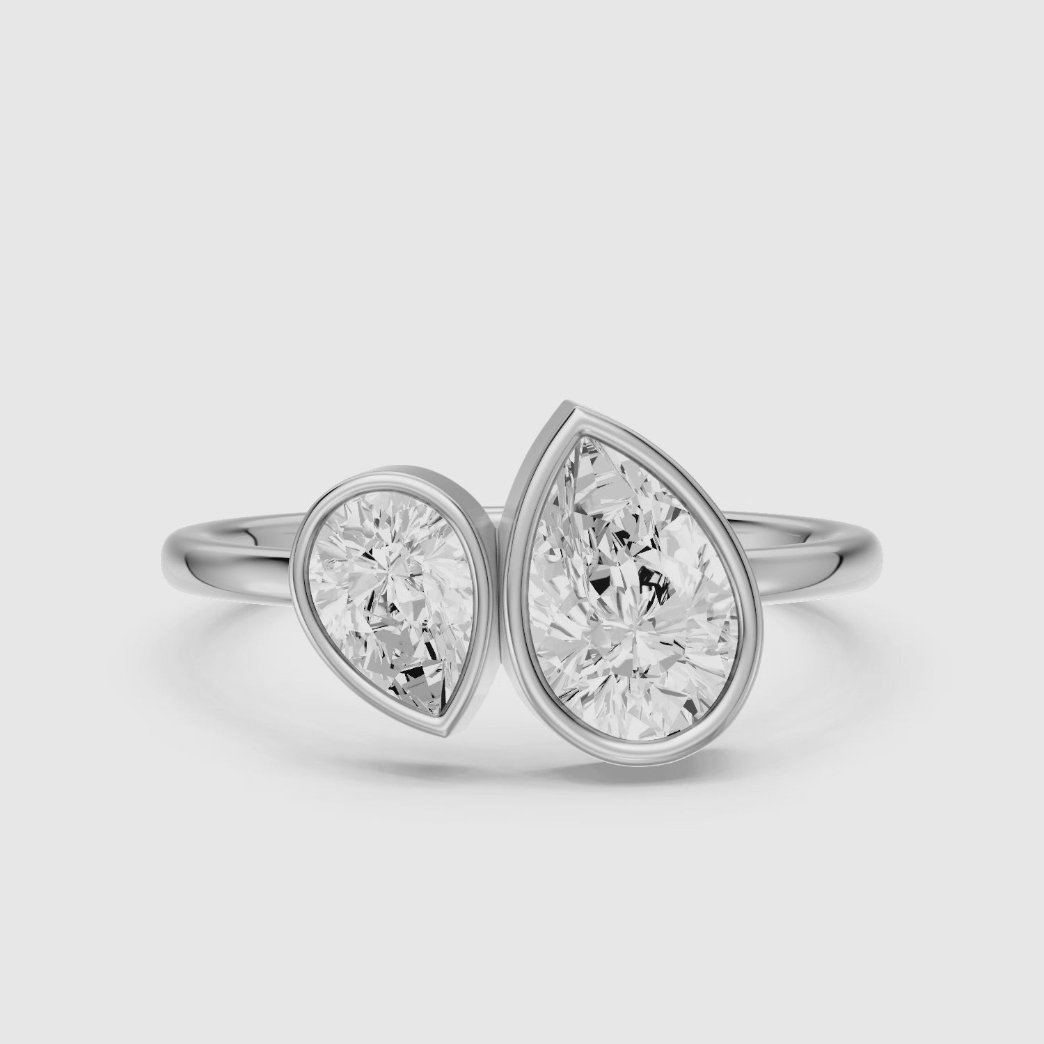 Load video: Nora Toi et Moi Pear Cut Lab Grown Diamond Ring in Bezel Setting