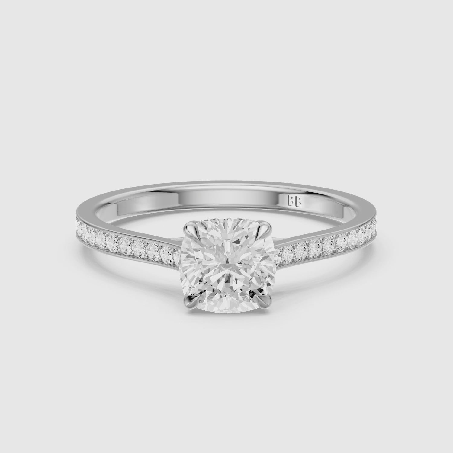 Load video: Kately Cushion Cut Side Stone Channel Set Moissanite Diamond Ring
