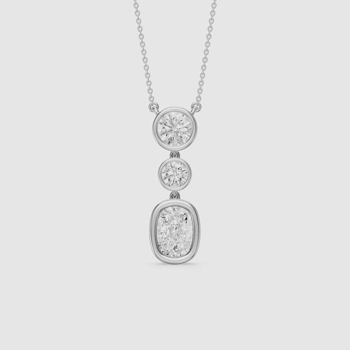 Load video: Demi Elongated Cushion and Round Bezel Lab Grown Diamond Drop Pendant