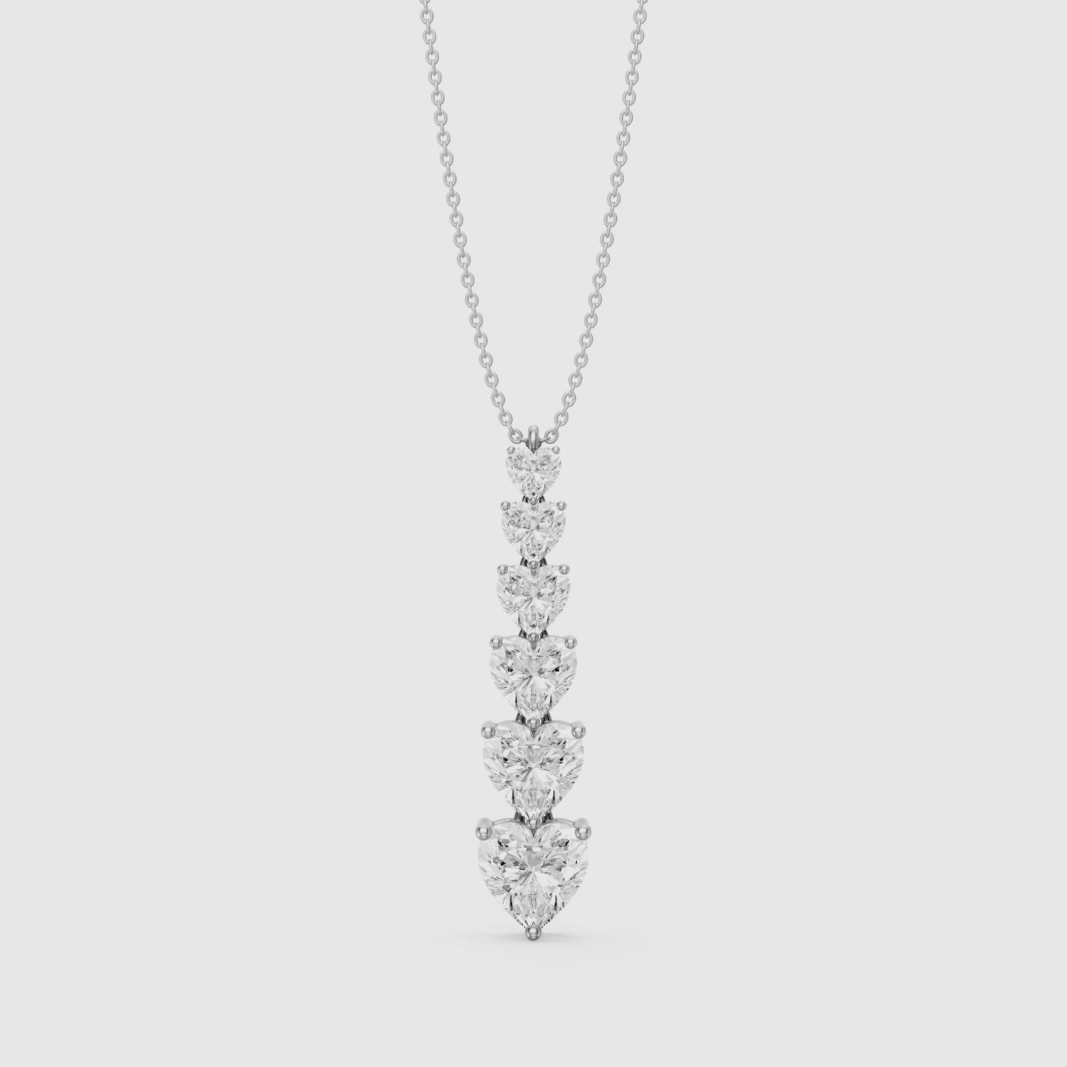 Load video: Effie Graduated Heart Shape Lab Grown Diamond Drop Pendant
