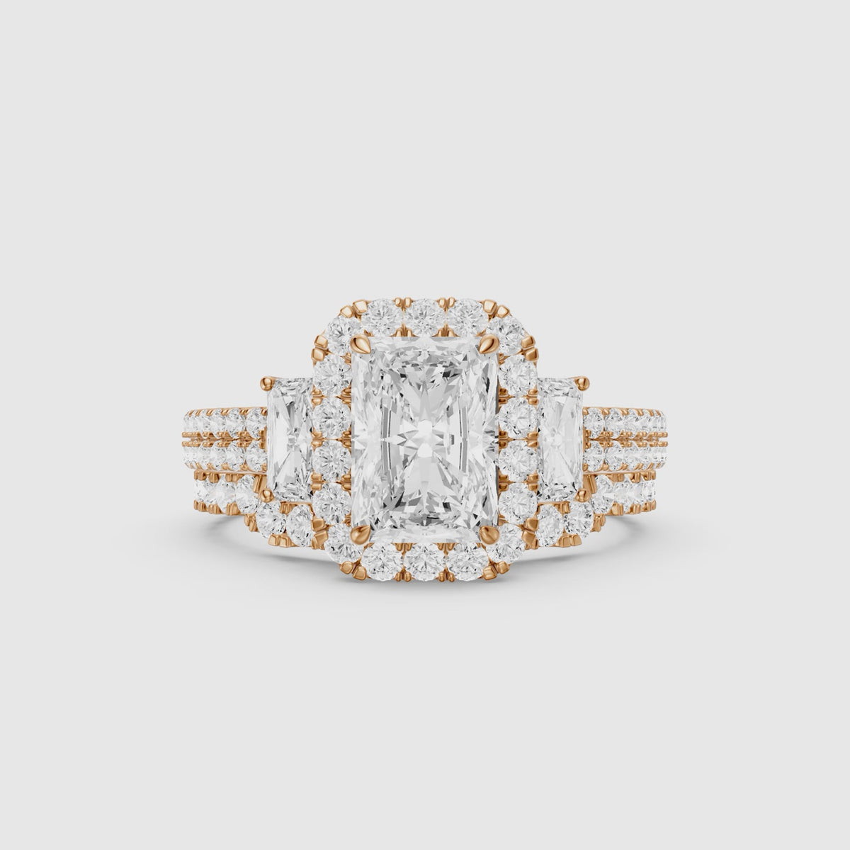 Load video: Seren Three Stone Radiant Cut Lab Grown Diamond Halo Bridal Set