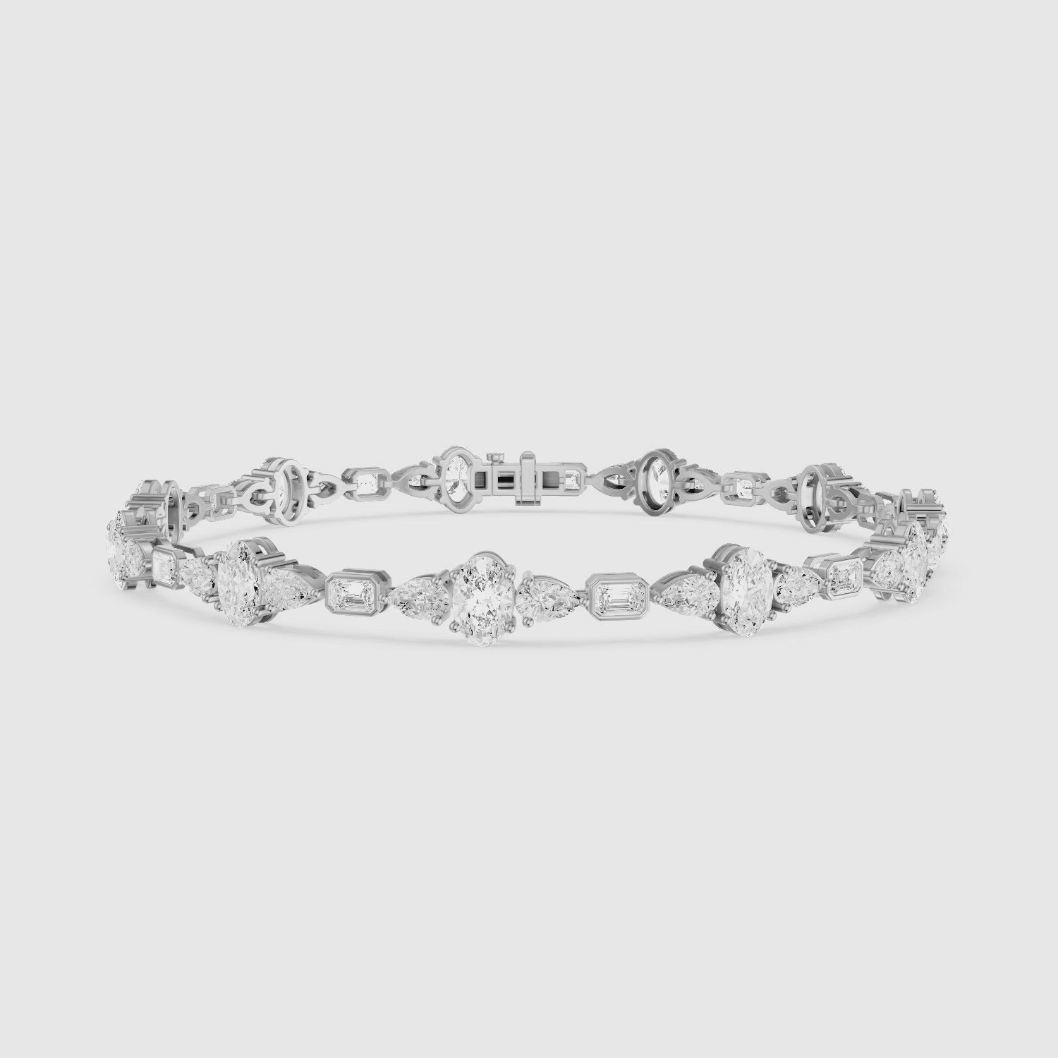 Load video: Remy Pear Oval with Bezeled Emerald Cut Lab Grown Diamond Tennis Bracelet