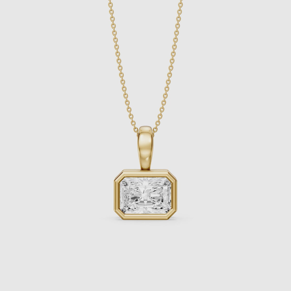 Load video: Maryam East West Radiant Cut Lab Grown Diamond Bezel Pendant