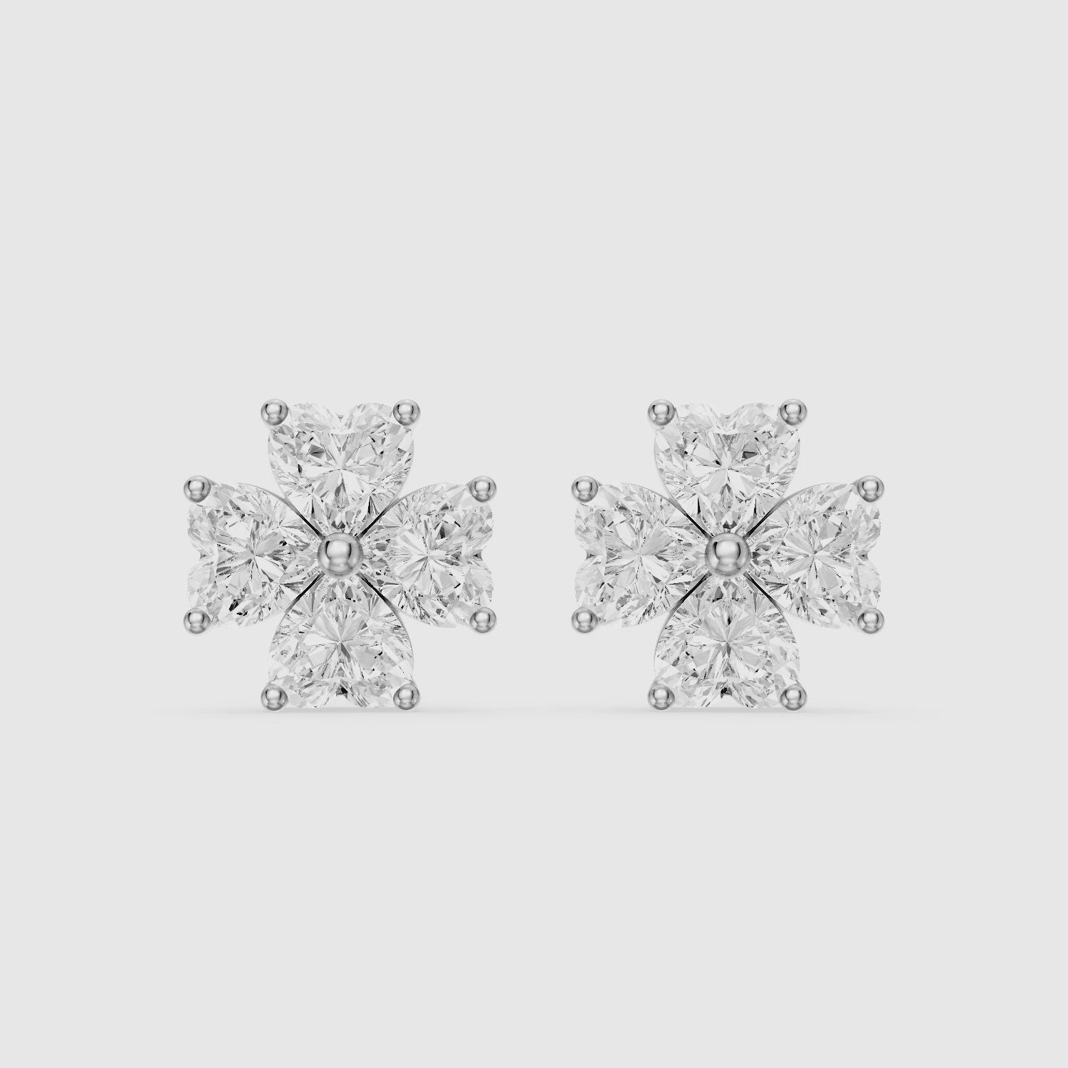 Load video: Eponine Heart Cut Lab Grown Diamond Four Petal Flower Stud Earrings