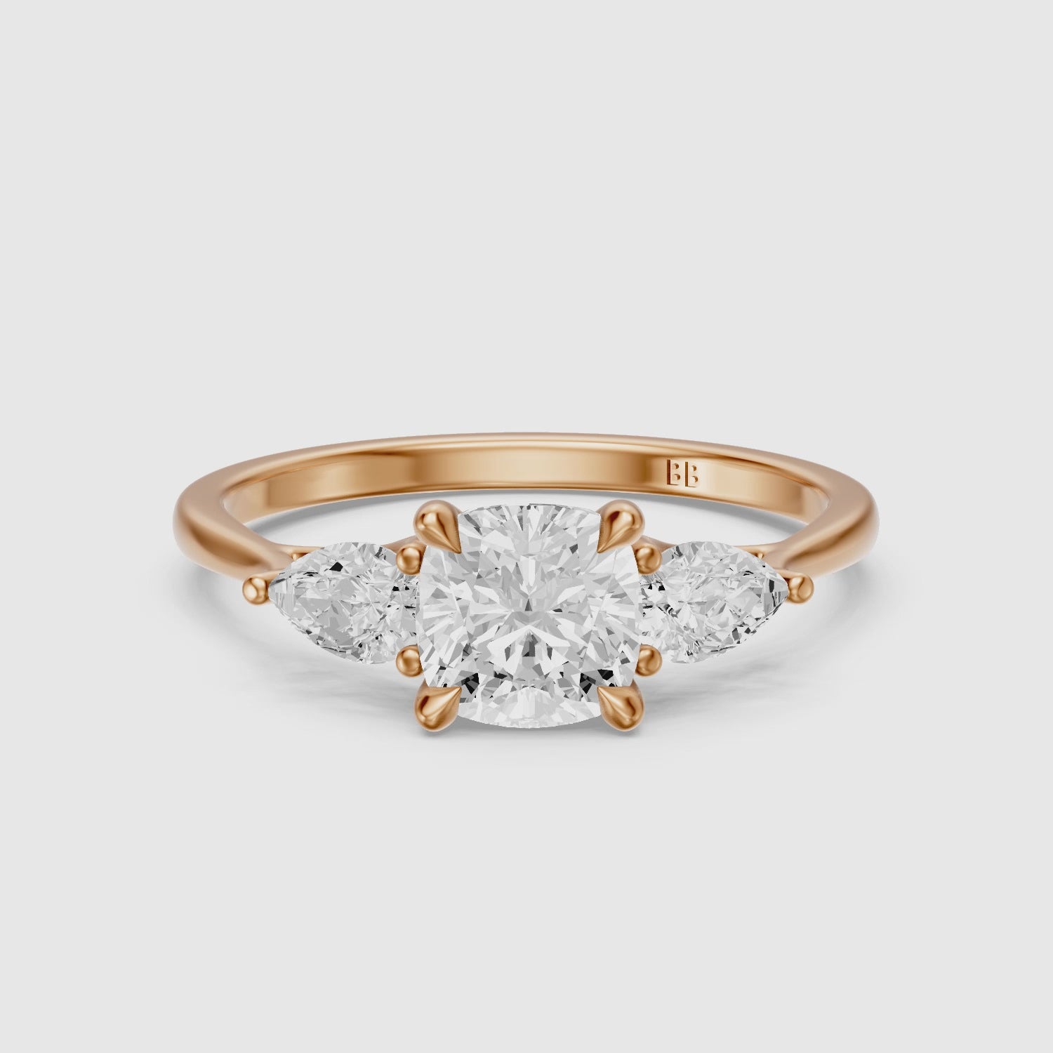 Load video: Meghan Three Stone Cushion With Pear Side Stones Moissanite Diamond Ring