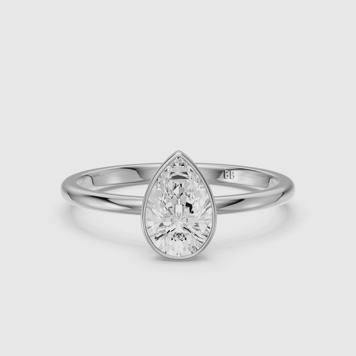 Load video: Kassia Pear Cut Bezel Set Solitaire Lab Grown Diamond Ring