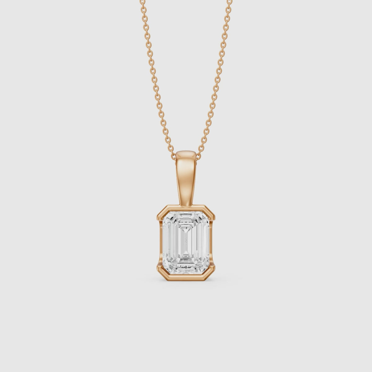 Load video: Catherine Emerald Cut Lab Grown Diamond Half Bezel Pendant