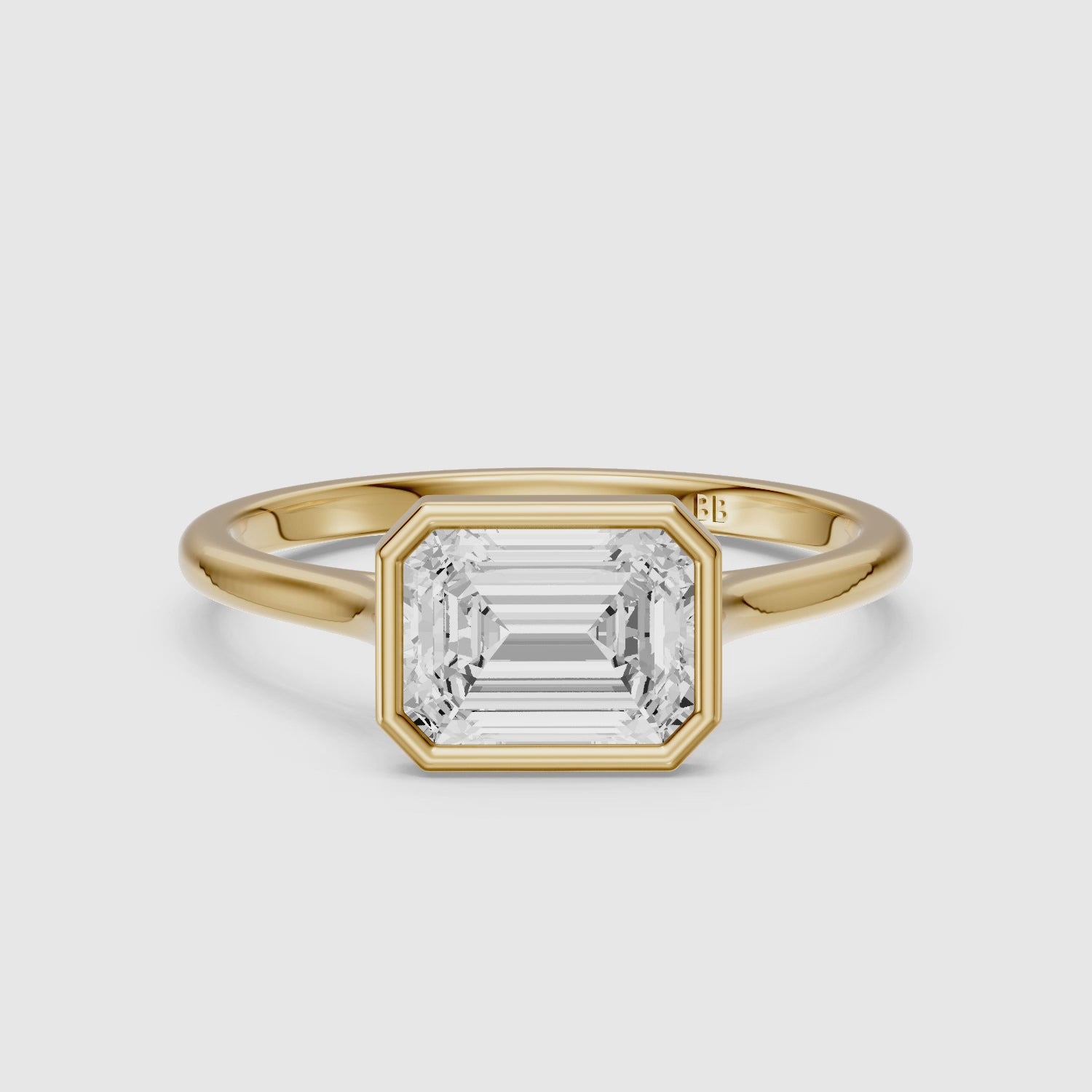 Load video: Abigail Emerald Cut East West Bezel Set Solitaire Moissanite Diamond Ring