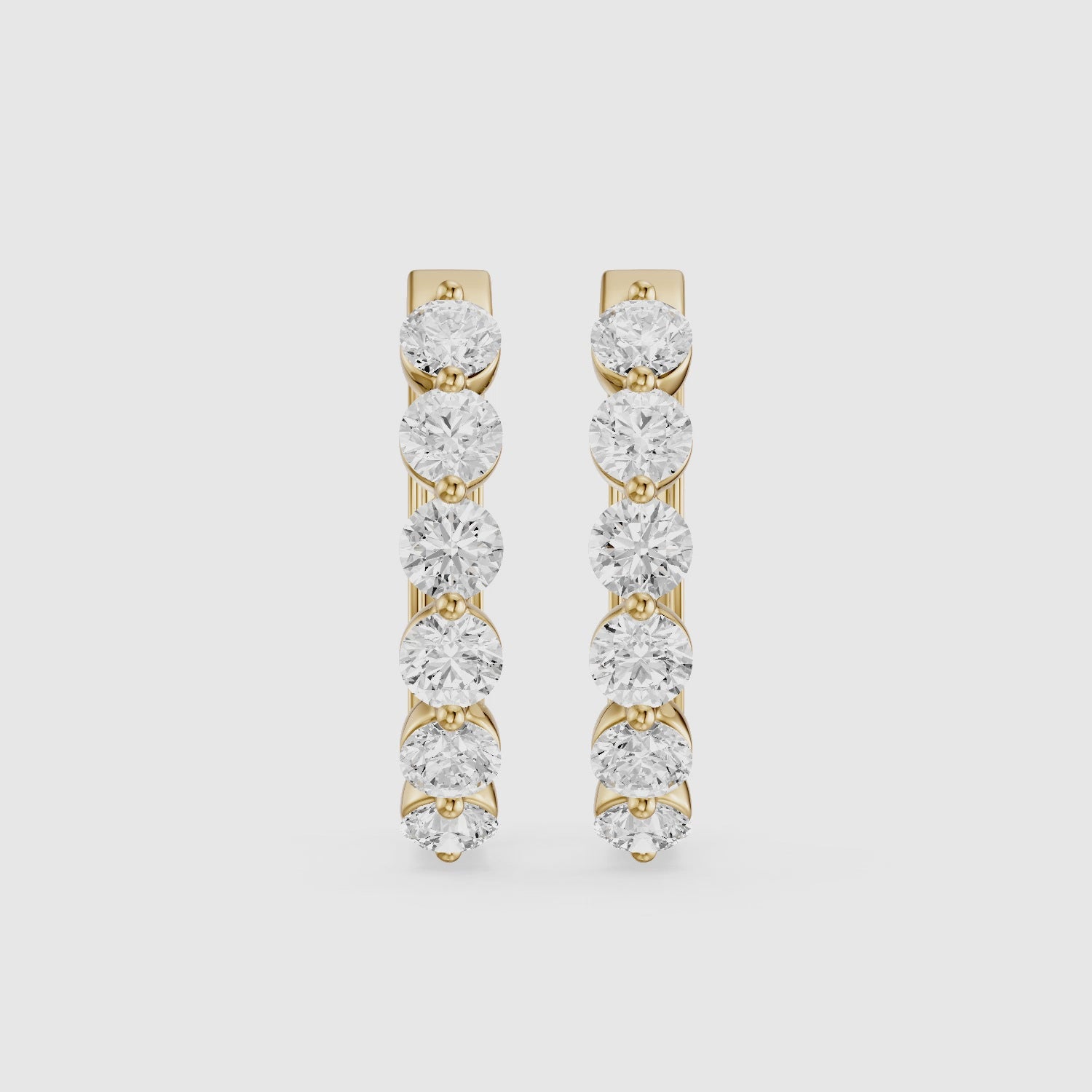 Load video: Yvette Round Cut Lab Grown Diamond Shared Prong Hoop Earrings