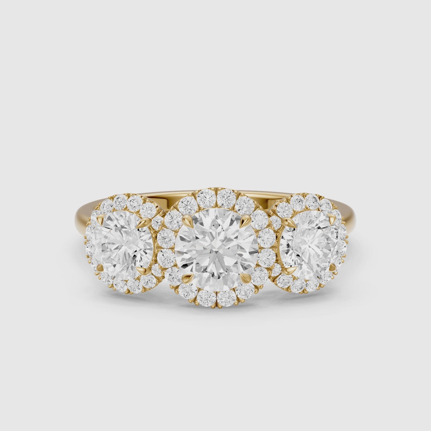Load video: Ashley Three Stone Round Halo Lab Grown Diamond Ring