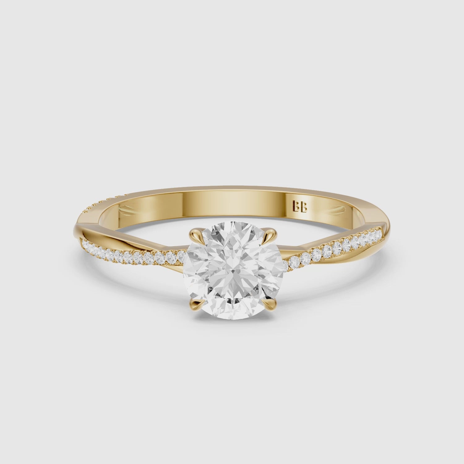 Load video: Carrie Round Cut Twisted Pave Side Stone Moissanite Diamond Ring