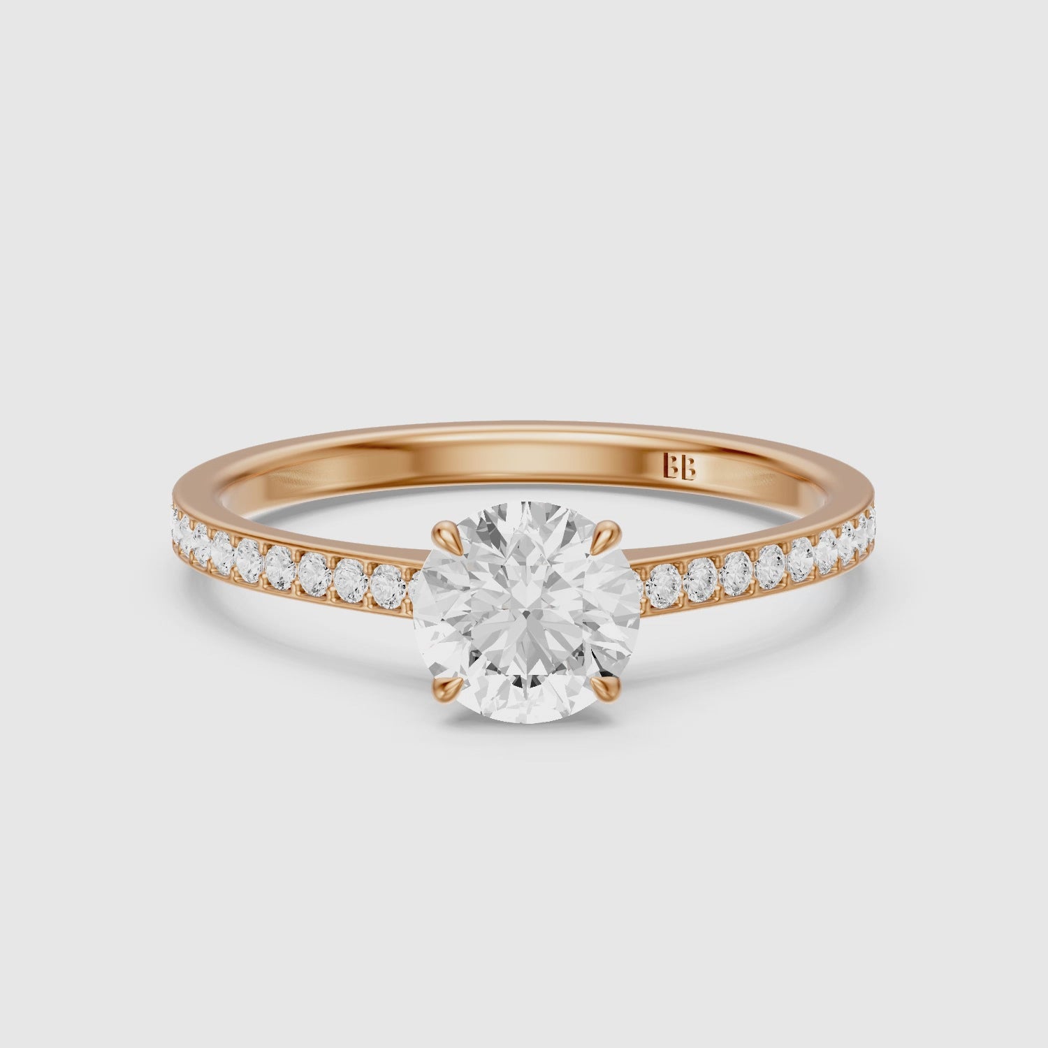 Load video: Alyssa Round Cut Side Stone Channel Set Moissanite Diamond Ring