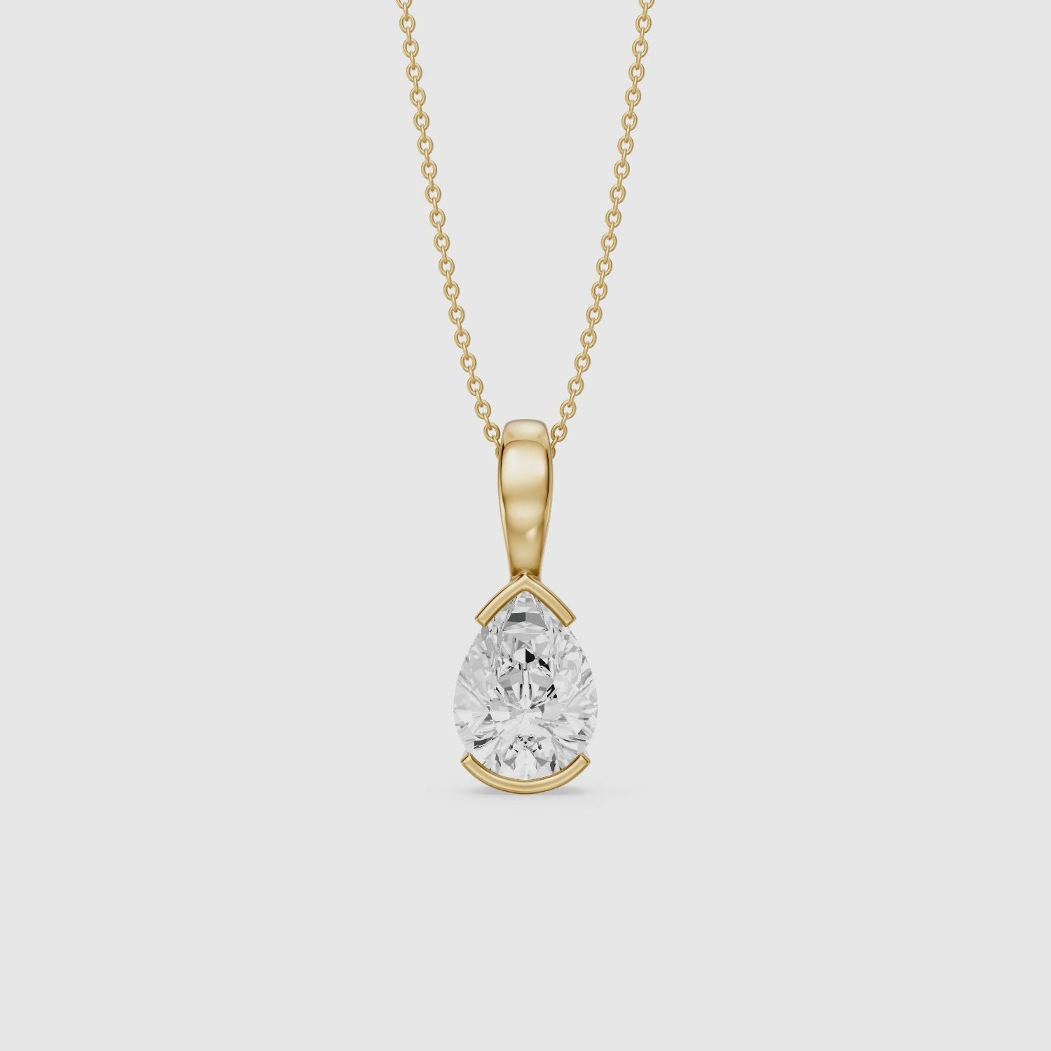 Load video: Adriana Pear Shape Lab Grown Diamond Half Bezel Pendant