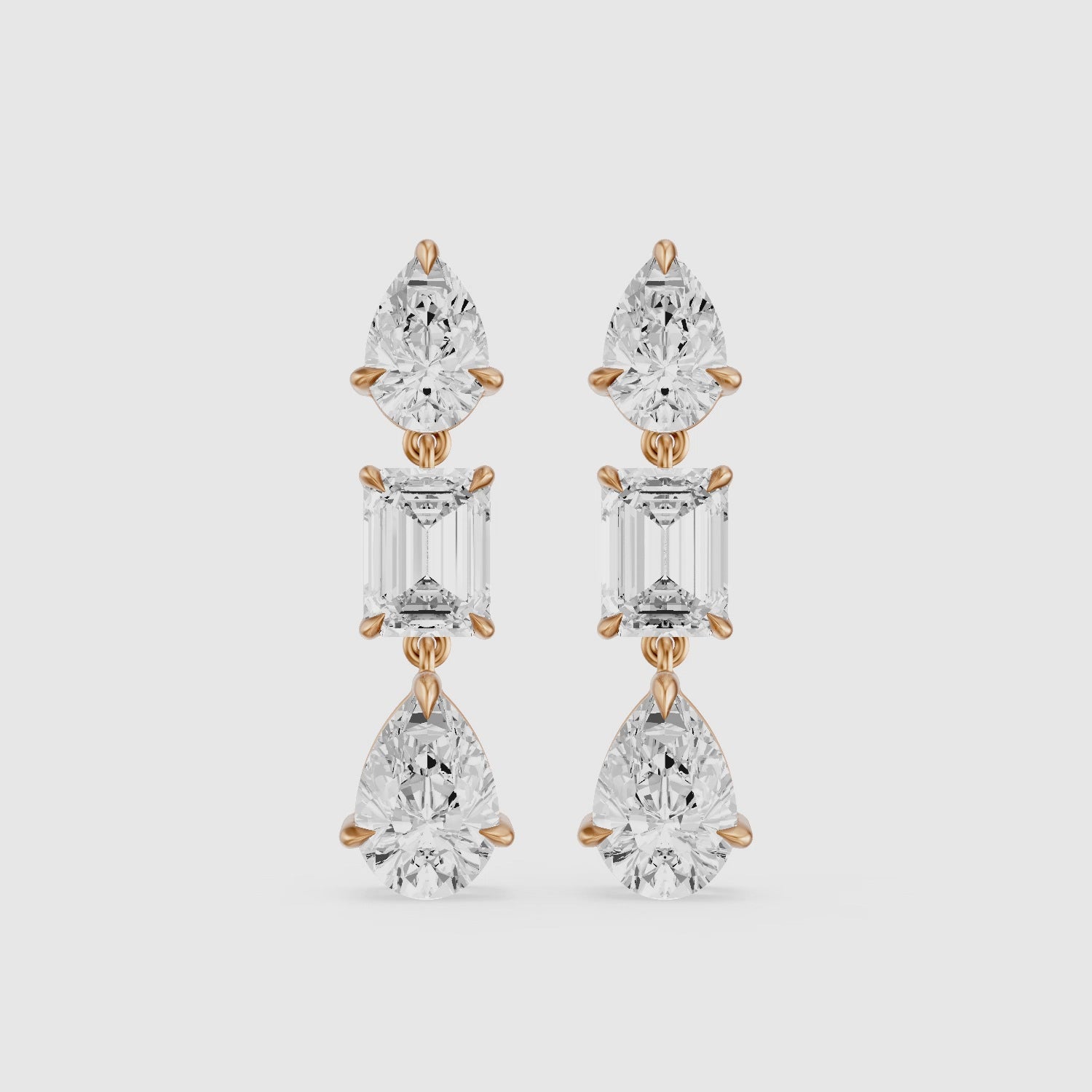 Load video: Acacia Emerald Cut and Pear Lab Grown Diamond Three Stone Drop Earrings
