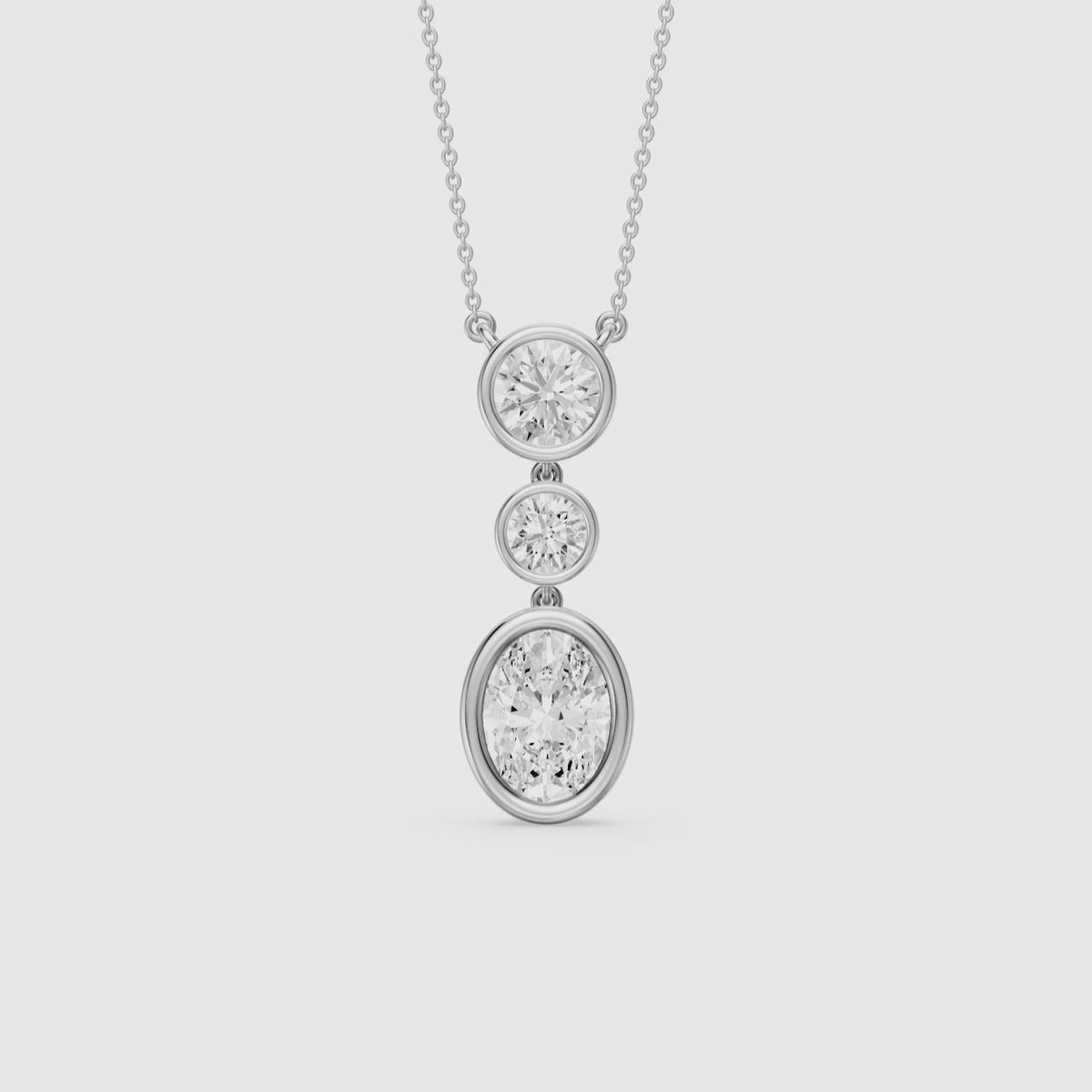 Load video: Malani Oval Cut and Round Cut Bezel Lab Grown Diamond Drop Pendant