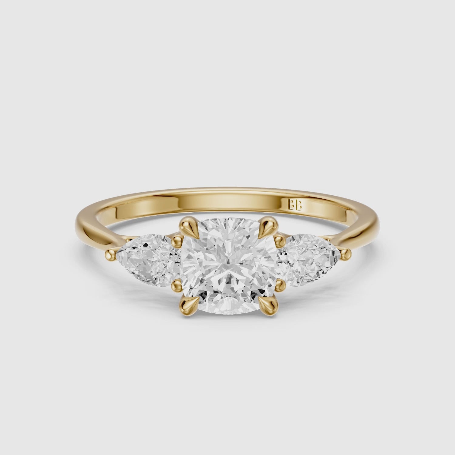 Load video: Meghan Three Stone Cushion With Pear Side Stones Moissanite Diamond Ring
