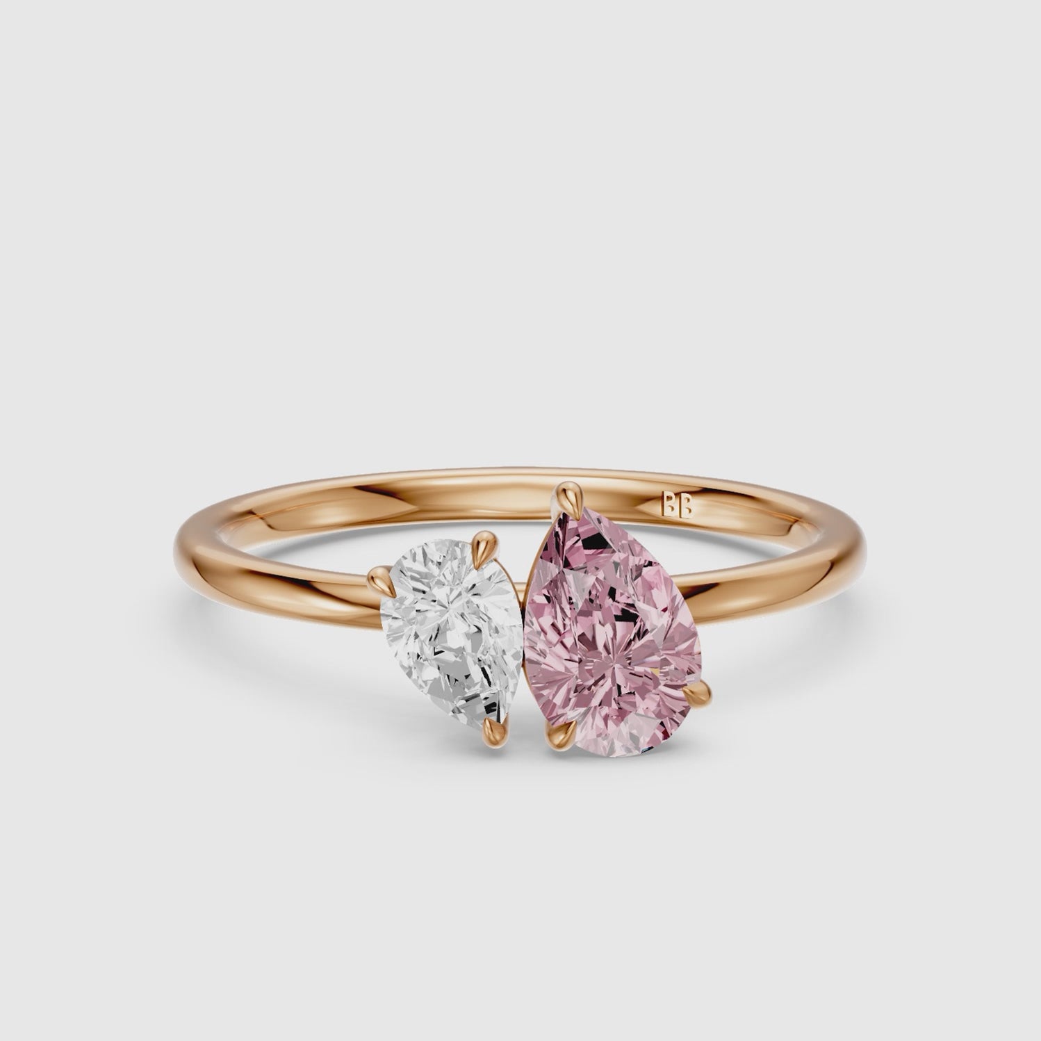 Load video: Kasia Pink and White Graduated Pear Shape Color Lab Grown Diamond Toi et Moi Ring