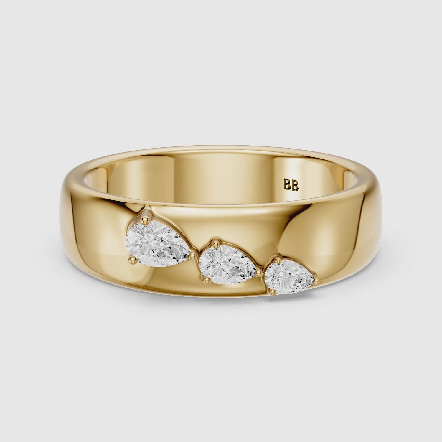 Load video: Britta Pear Cut Lab Diamond Graduated Three Stone Cigar Band