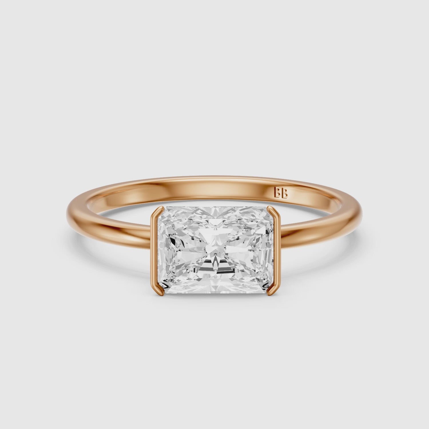 Load video: Penelope Radiant Cut East West Half Bezel Moissanite Diamond Ring