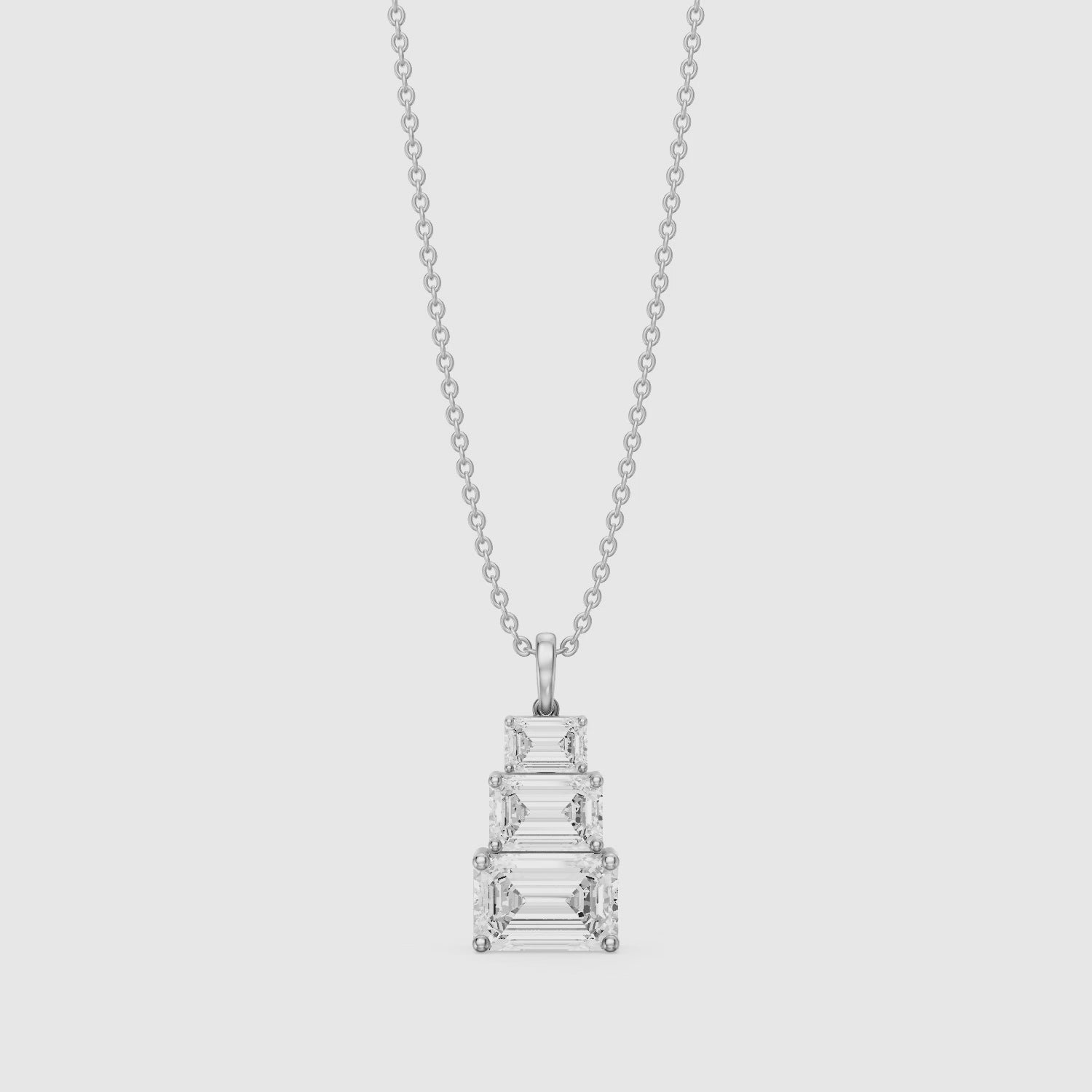 Load video: Carla Emerald Cut Lab Grown Diamond Graduated Pendant