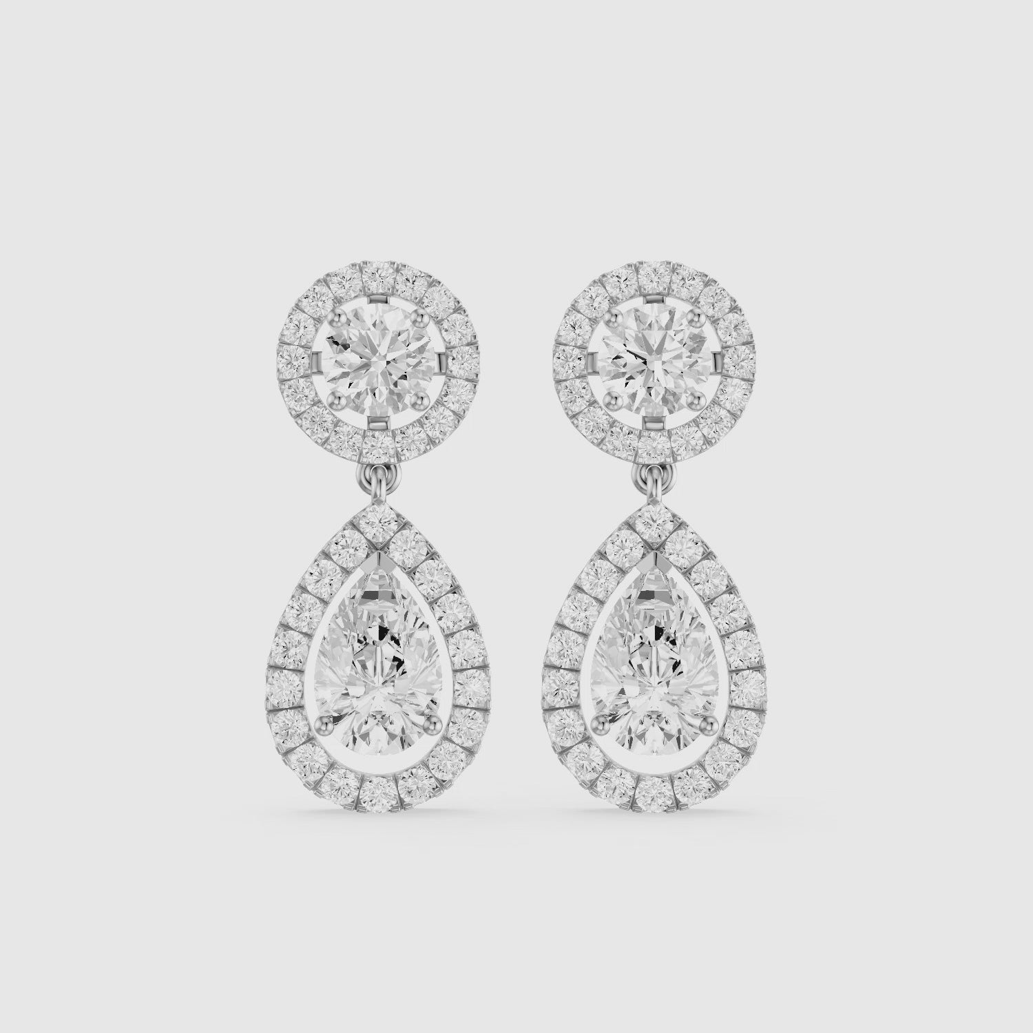 Load video: Echo Round and Pear Shaped Halo Lab Grown Diamond Drop Earrings