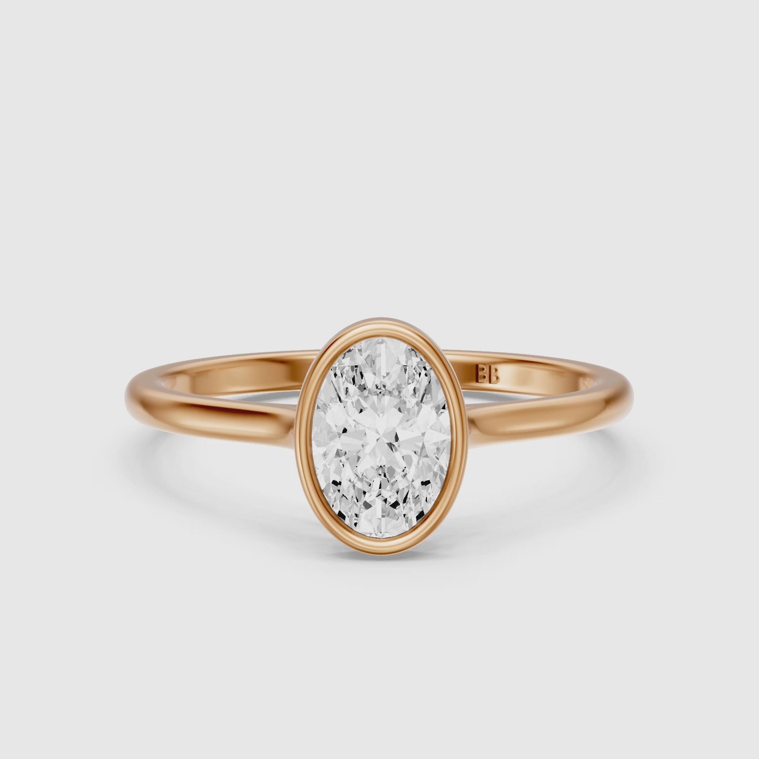Load video: Nina Oval Cut Bezel Set Solitaire Lab Grown Diamond Ring
