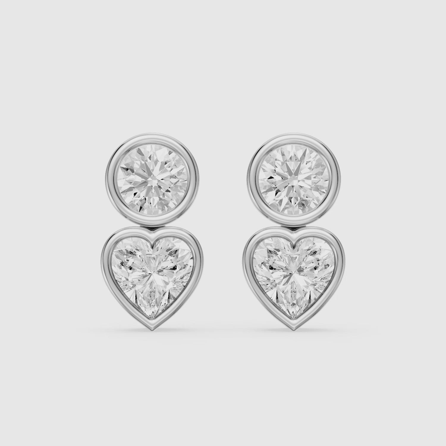 Load video: Veda Heart and Round Lab Grown Diamond Bezel Stud Earrings