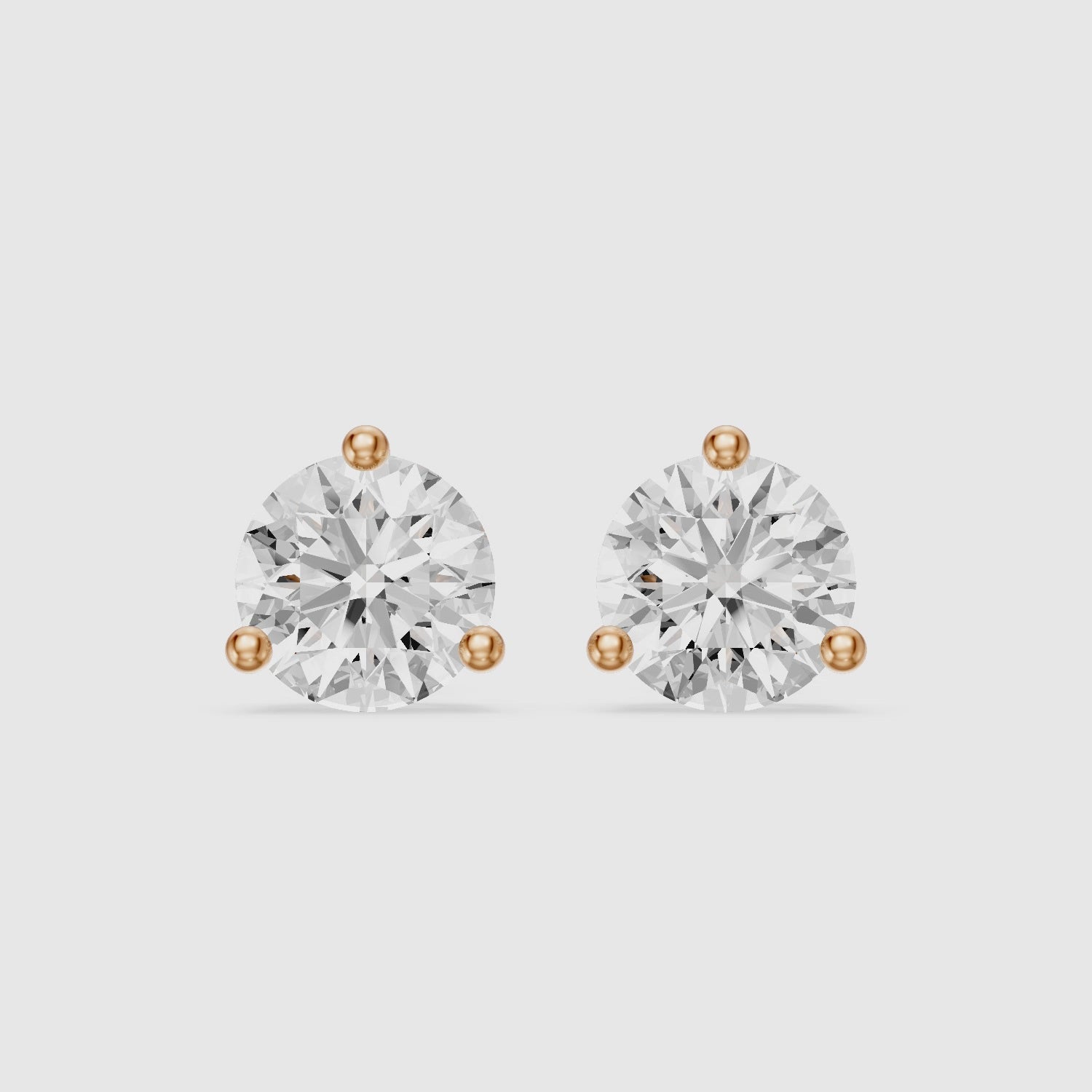 Load video: Daria Round Cut Lab Diamond Three Prong Solitaire Stud Earrings