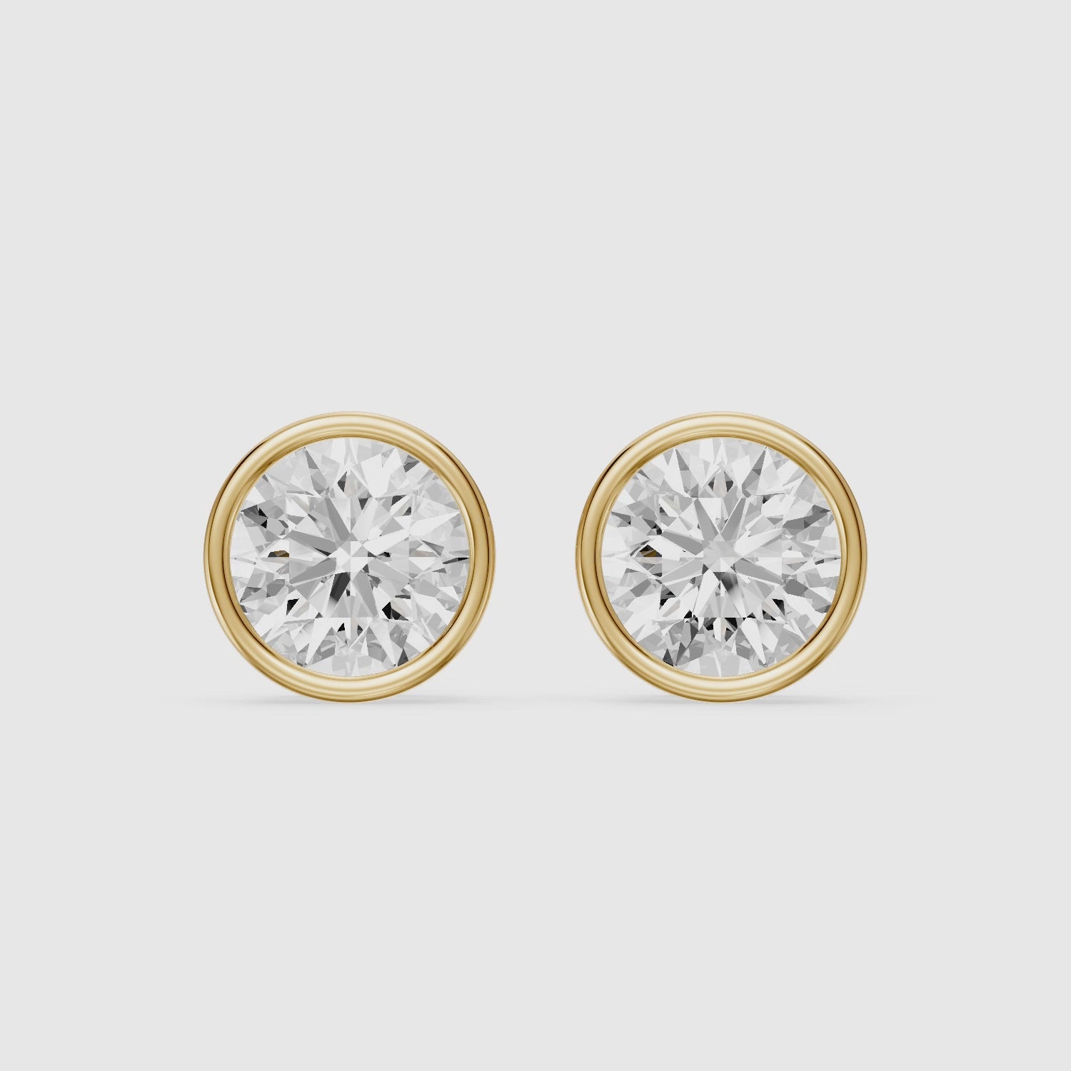 Load video: Meliora Round Cut Lab Grown Diamond Solitaire Bezel Stud Earrings