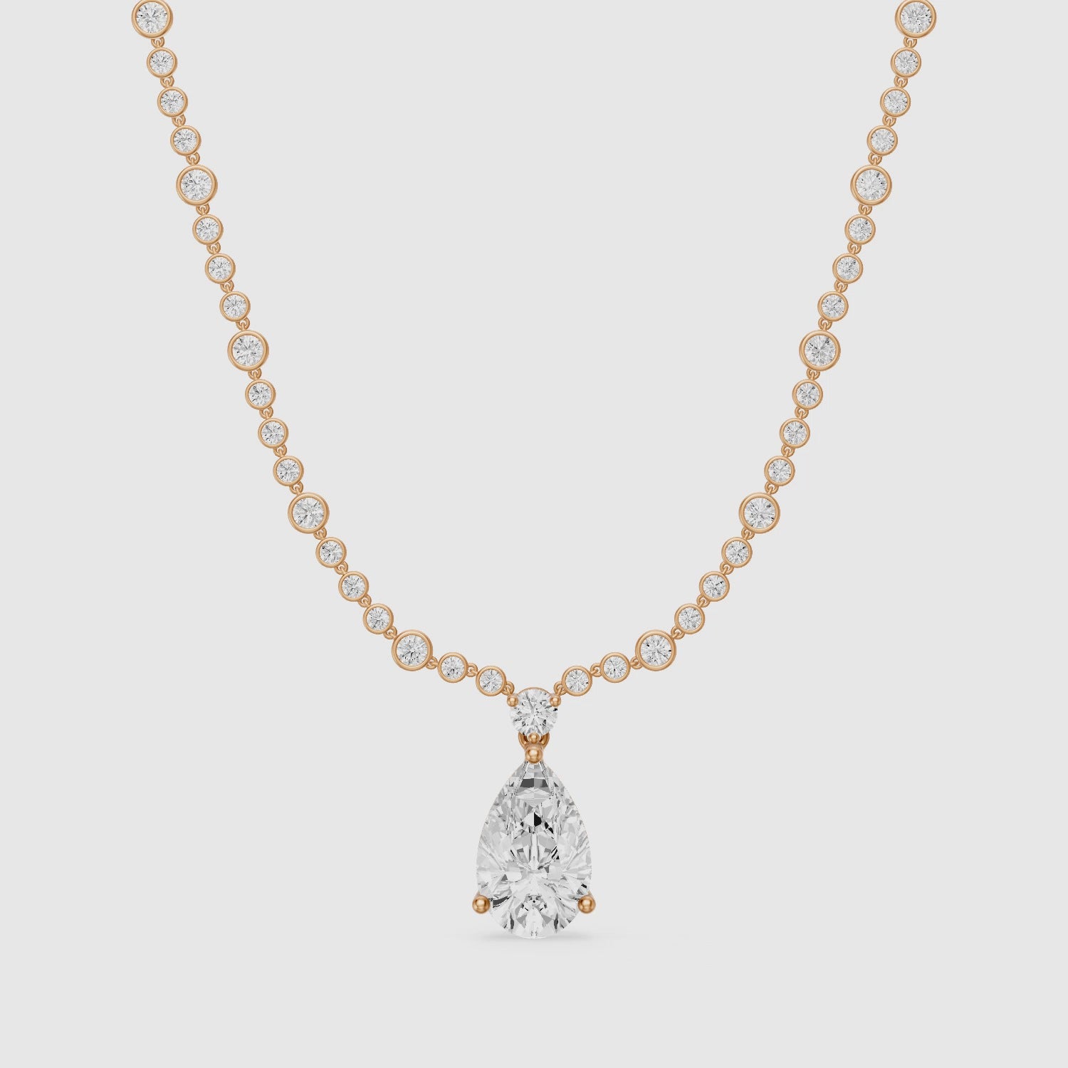 Load video: Estella Graduated Round Bezel Lab Grown Diamond Pear Drop Necklace