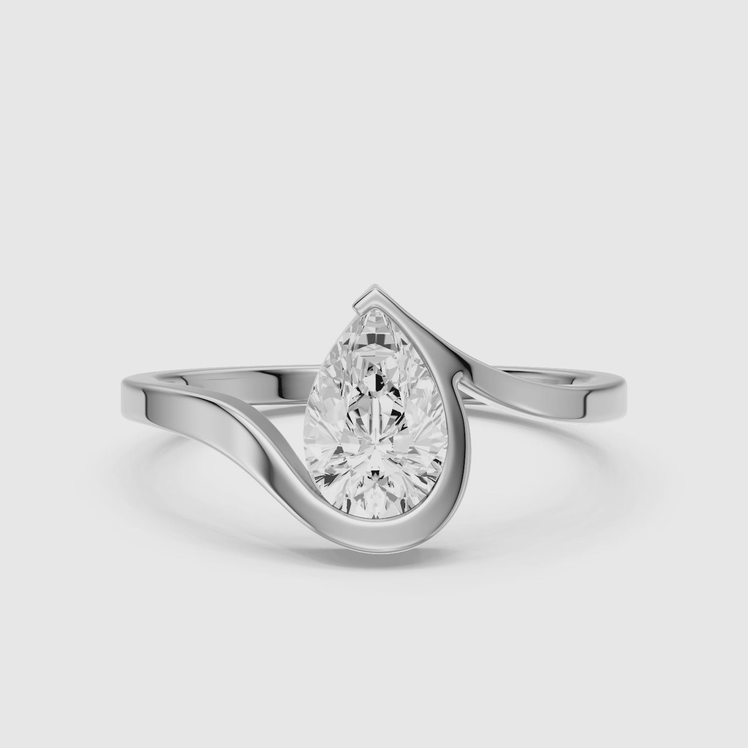Load video: Lyra Pear Shape Moissanite Diamond Half Bezel Ring