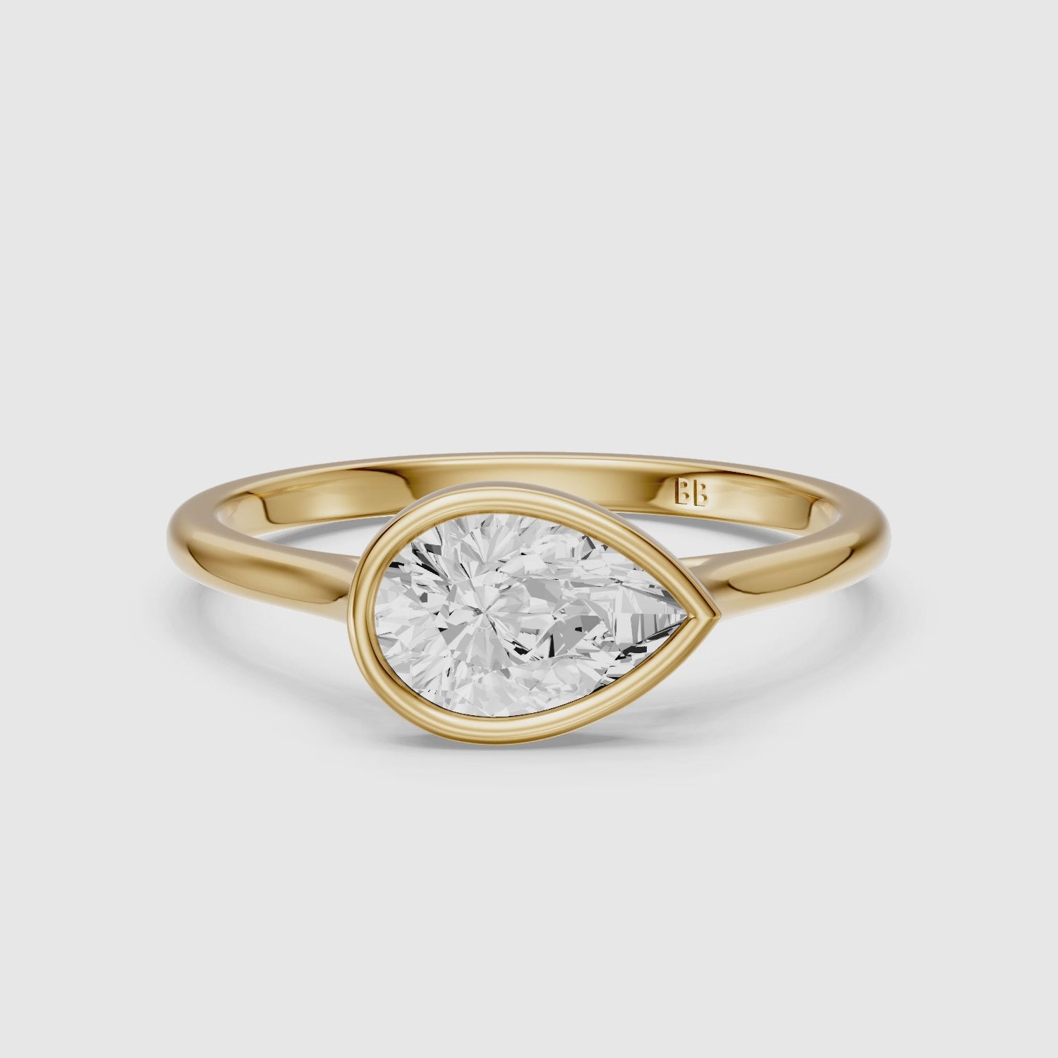 Load video: Madison Pear Cut East West Bezel Lab Grown Diamond Engagement Ring
