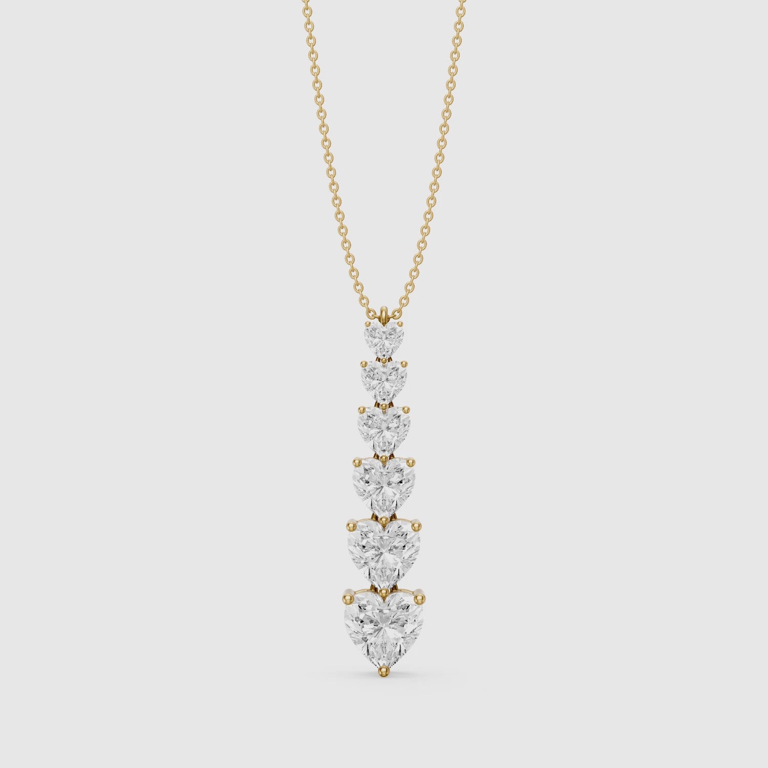 Load video: Effie Graduated Heart Shape Lab Grown Diamond Drop Pendant