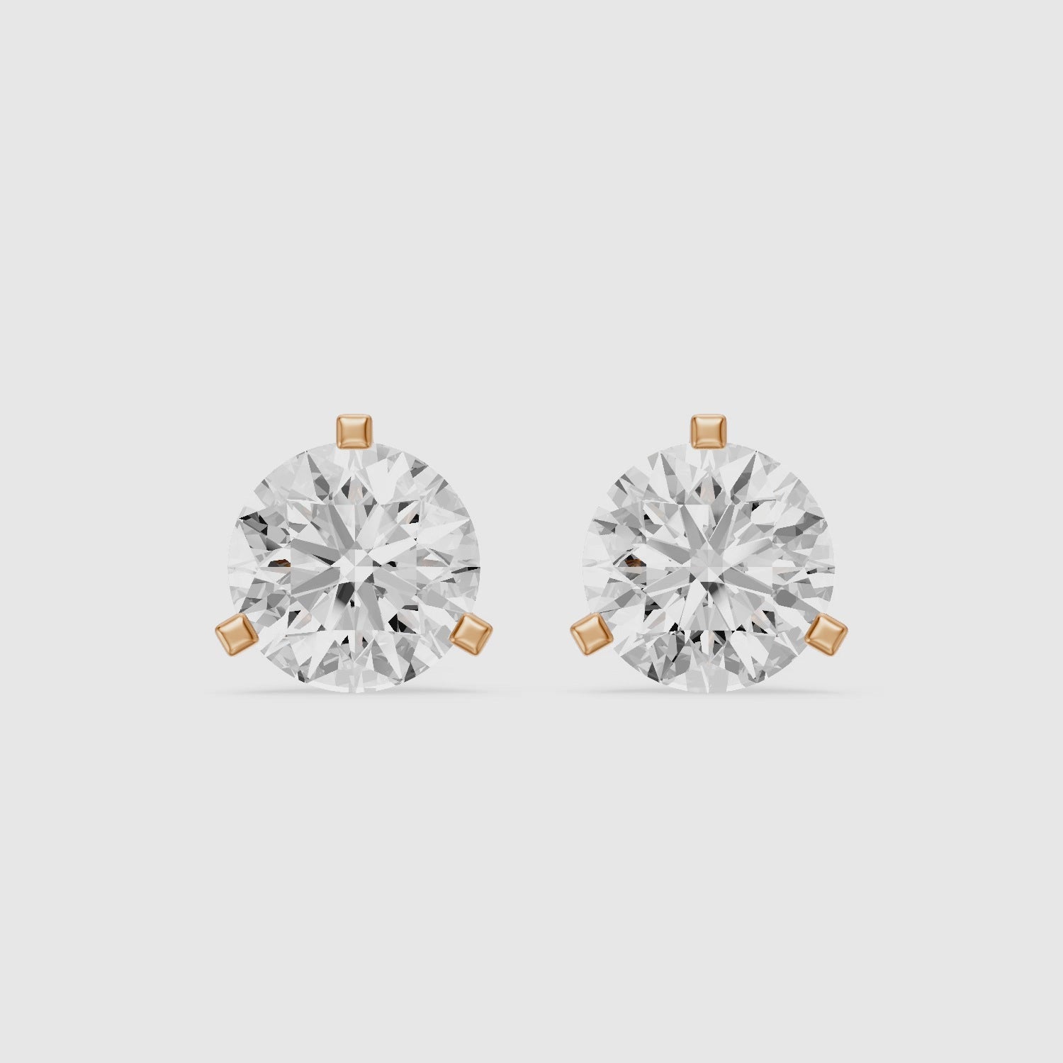Load video: Beatriz Round Cut Lab Grown Diamond Three Prong Stud Earrings