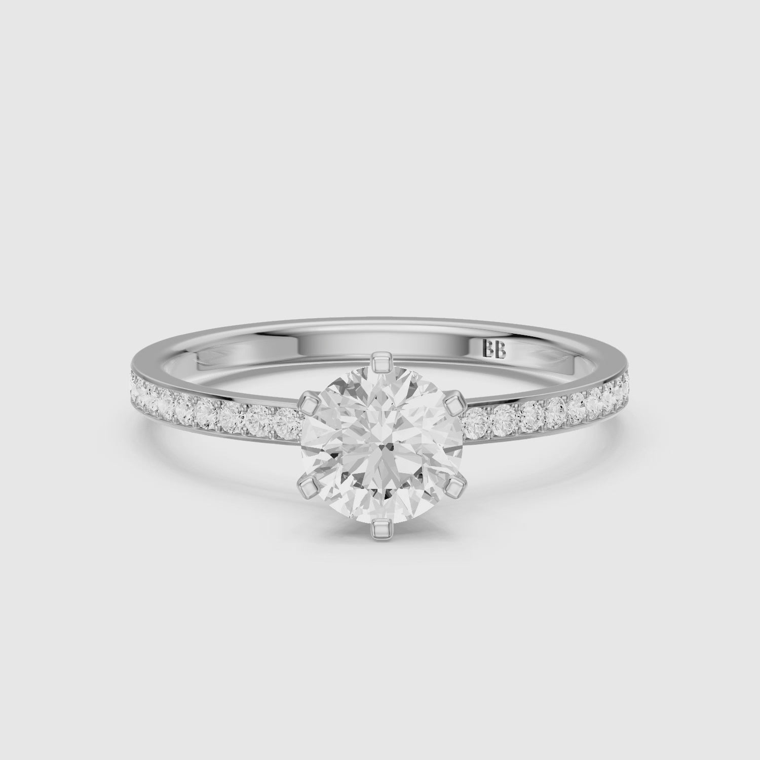 Load video: Keegan 6 Prong Round Cut Channel Set Moissanite Diamond Ring